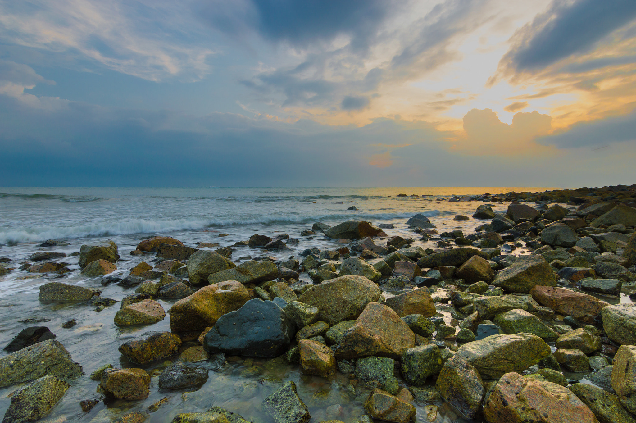 Nikon D3200 sample photo. Beach stone with sunrise background photography