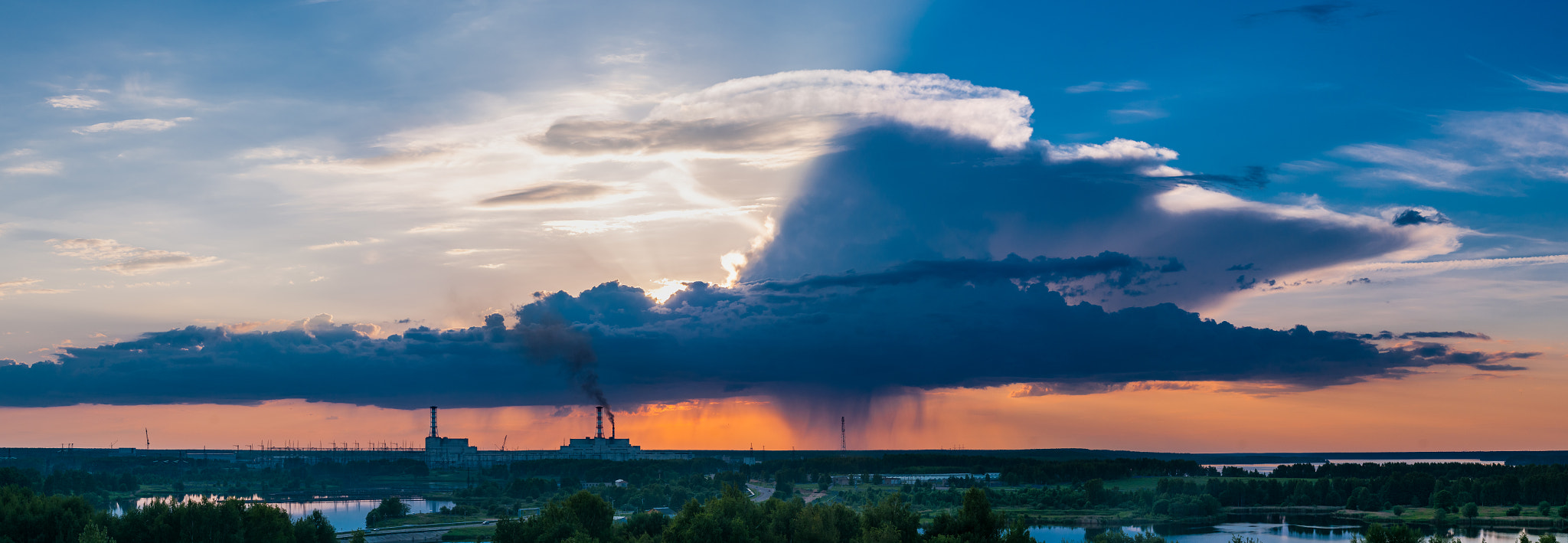 Nikon D300S + Nikon AF Nikkor 50mm F1.4D sample photo. Nuclear power plant with an intense golden and cloudy sky photography