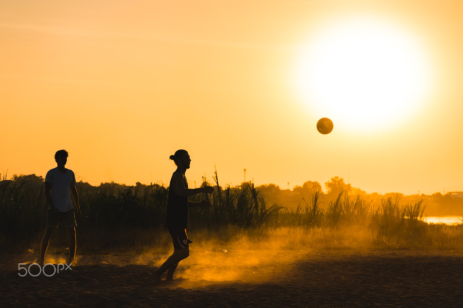 Sony Alpha NEX-6 sample photo. Two guys playing football under the sun photography