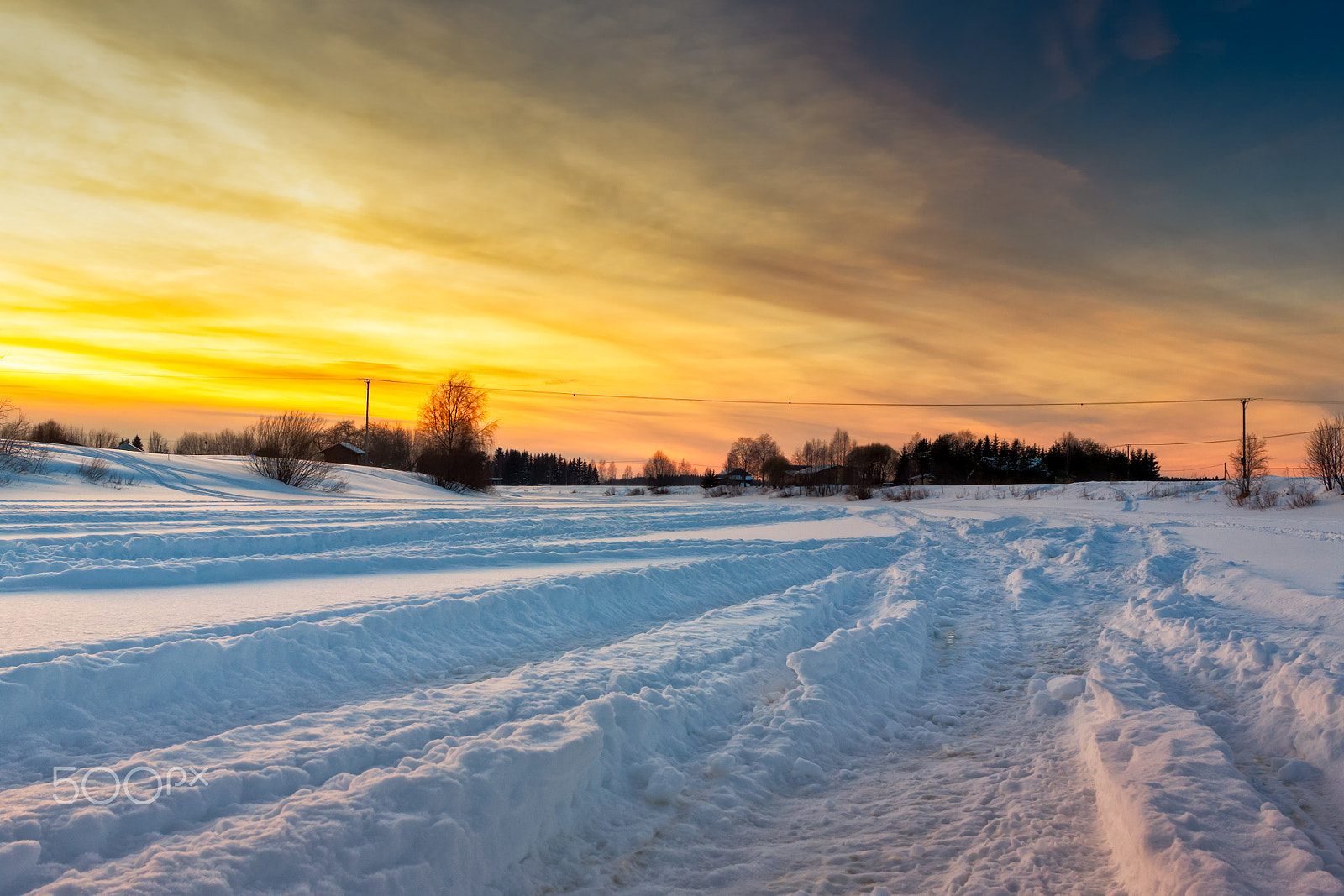 Canon EF-S 24mm F2.8 STM sample photo. Snowmobile tracks in the deep snow photography