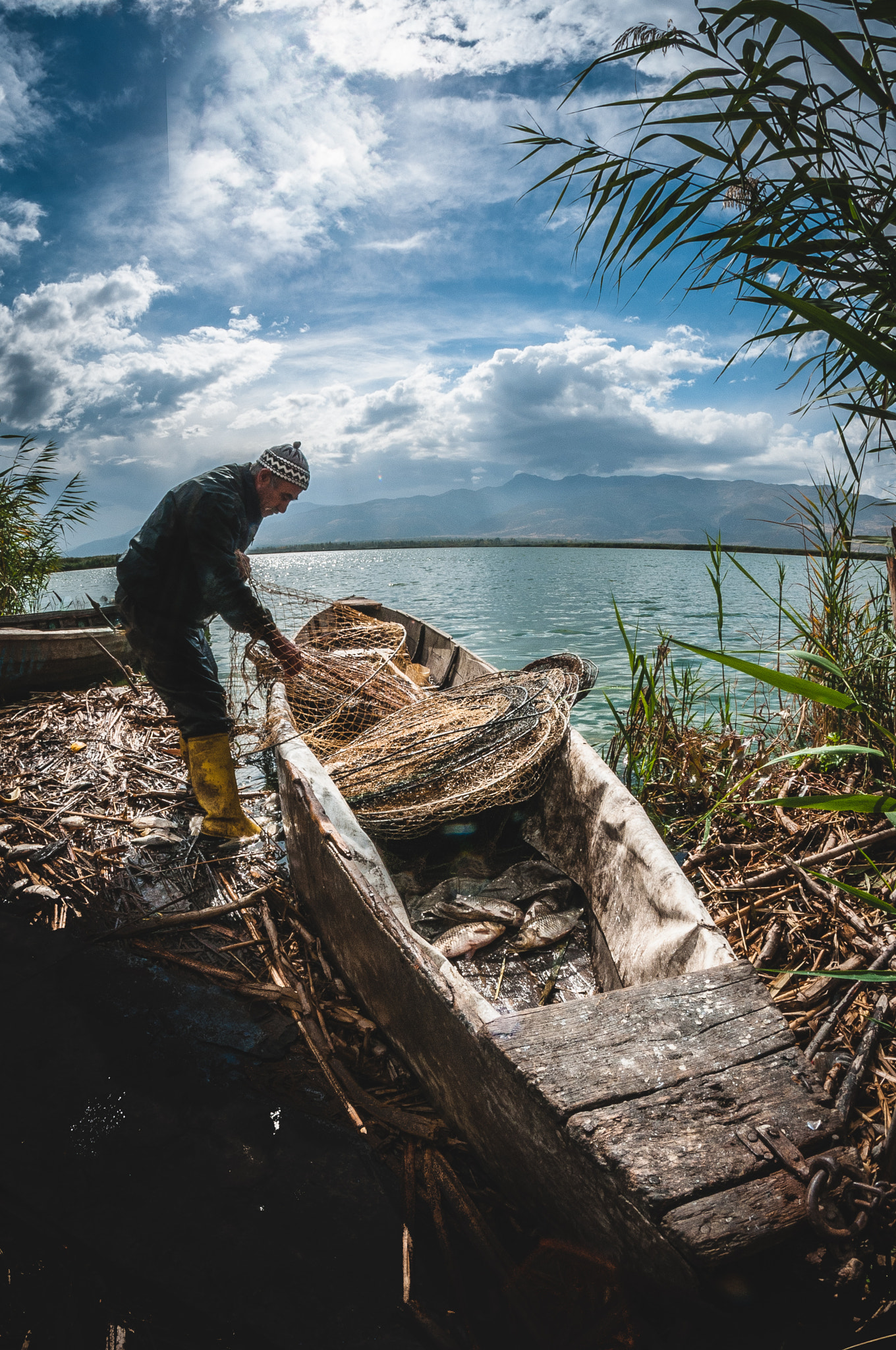 Nikon D300 + Samyang 8mm F3.5 Aspherical IF MC Fisheye sample photo. Fisherman photography