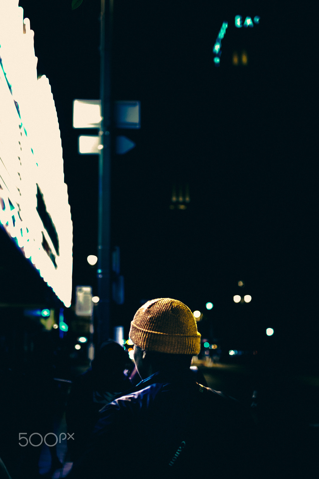 Sigma 30mm F1.4 EX DC HSM sample photo. Man in yellow beanie exploring urban landscape photography