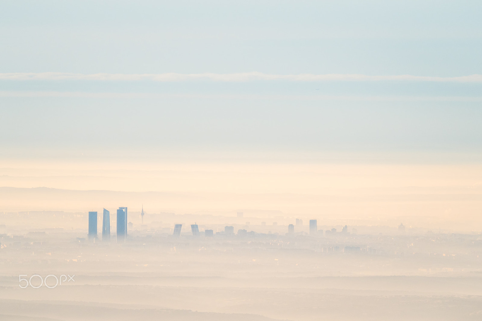 Olympus OM-D E-M5 II + Olympus M.Zuiko Digital ED 40-150mm F2.8 Pro sample photo. Far aerial view of madrid city with fog in the morning photography