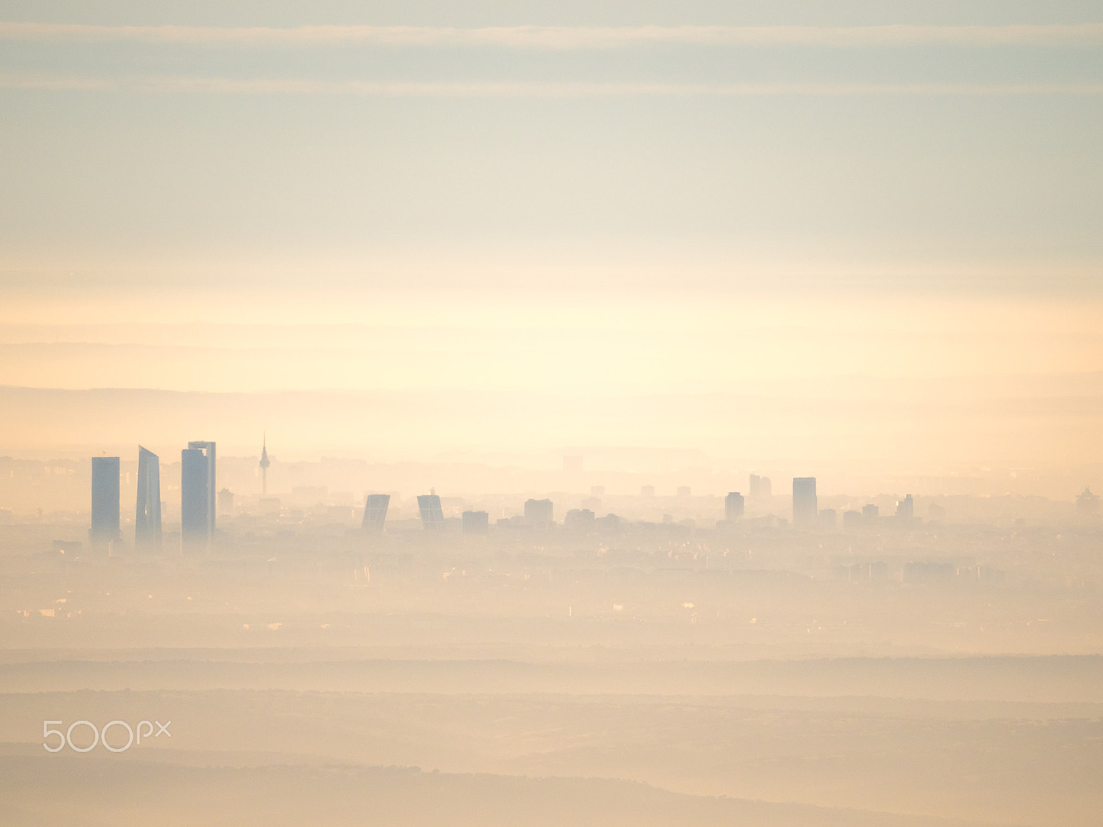 Olympus OM-D E-M5 II + Olympus M.Zuiko ED 75-300mm F4.8-6.7 II sample photo. Far aerial view of madrid city with fog in the morning photography