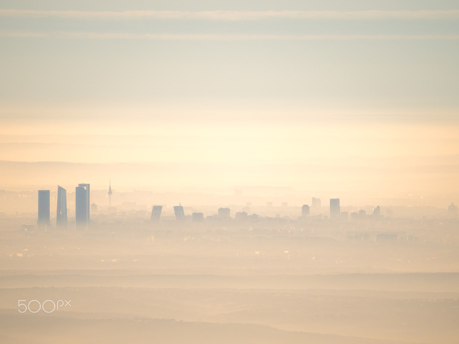 Olympus OM-D E-M5 II sample photo. Far aerial view of madrid city with fog in the morning photography