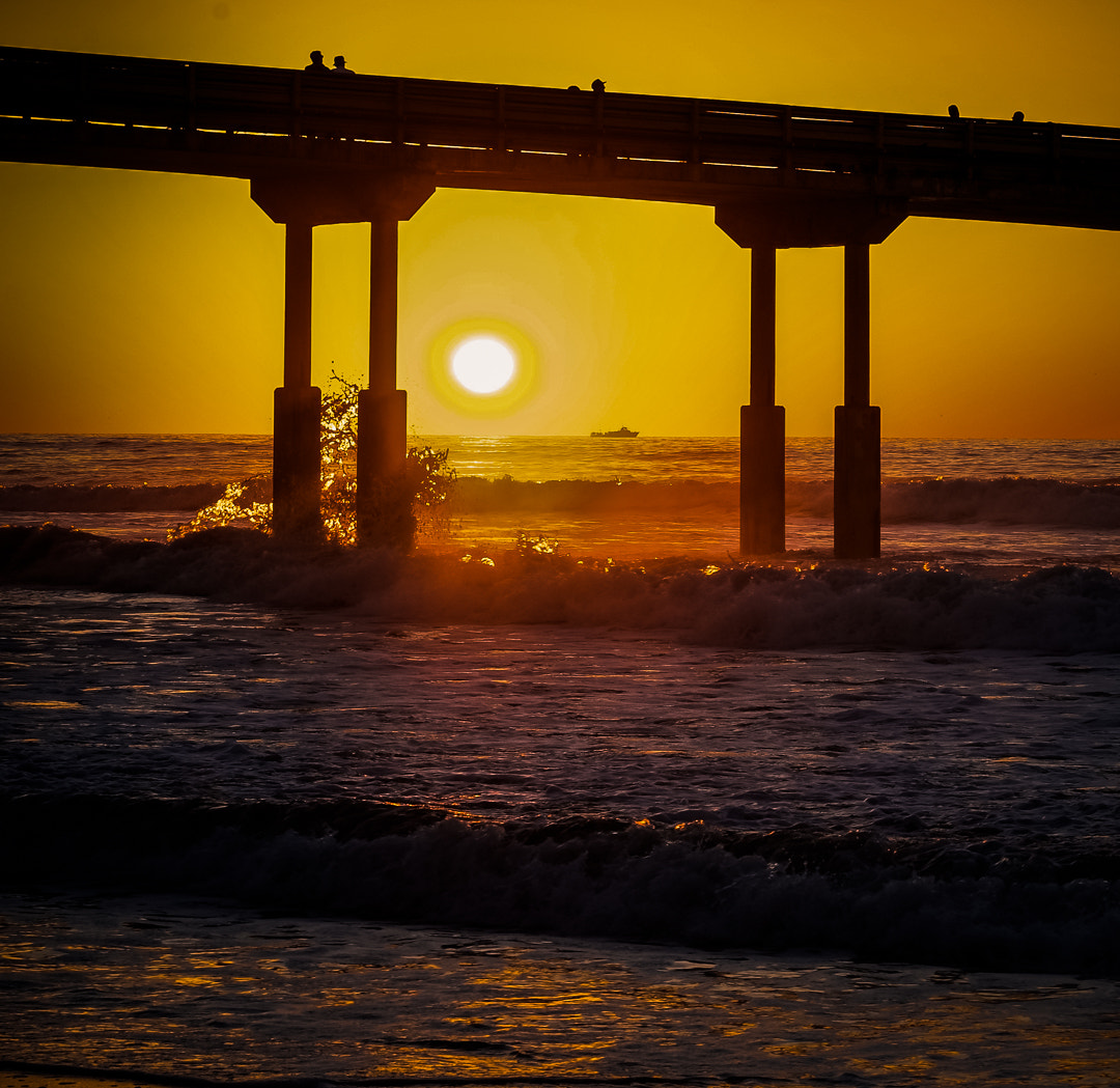 Sony FE 85mm F1.4 GM sample photo. Sunset at ocean beach pier photography
