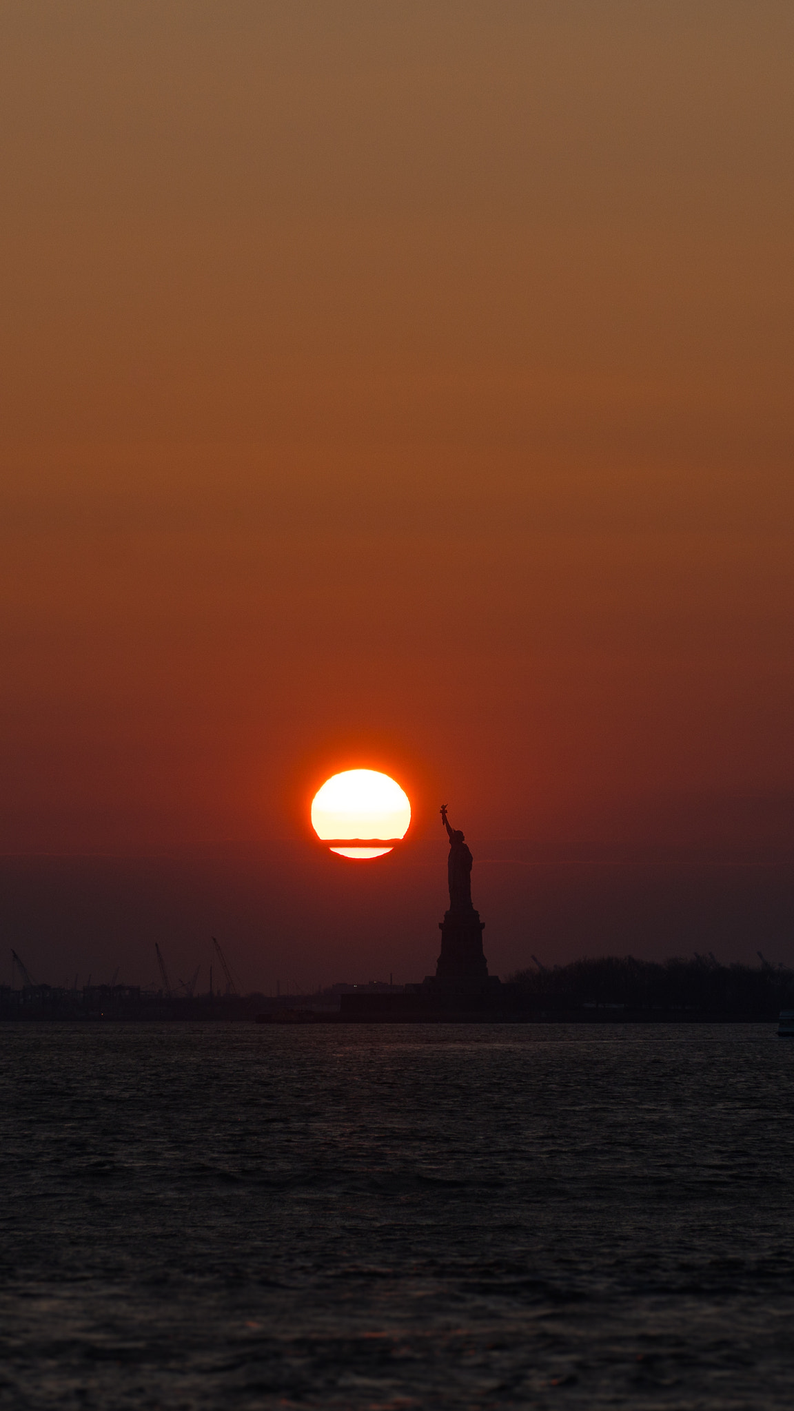 Sony E PZ 18-105mm F4 G OSS sample photo. Sunset on liberty  photography