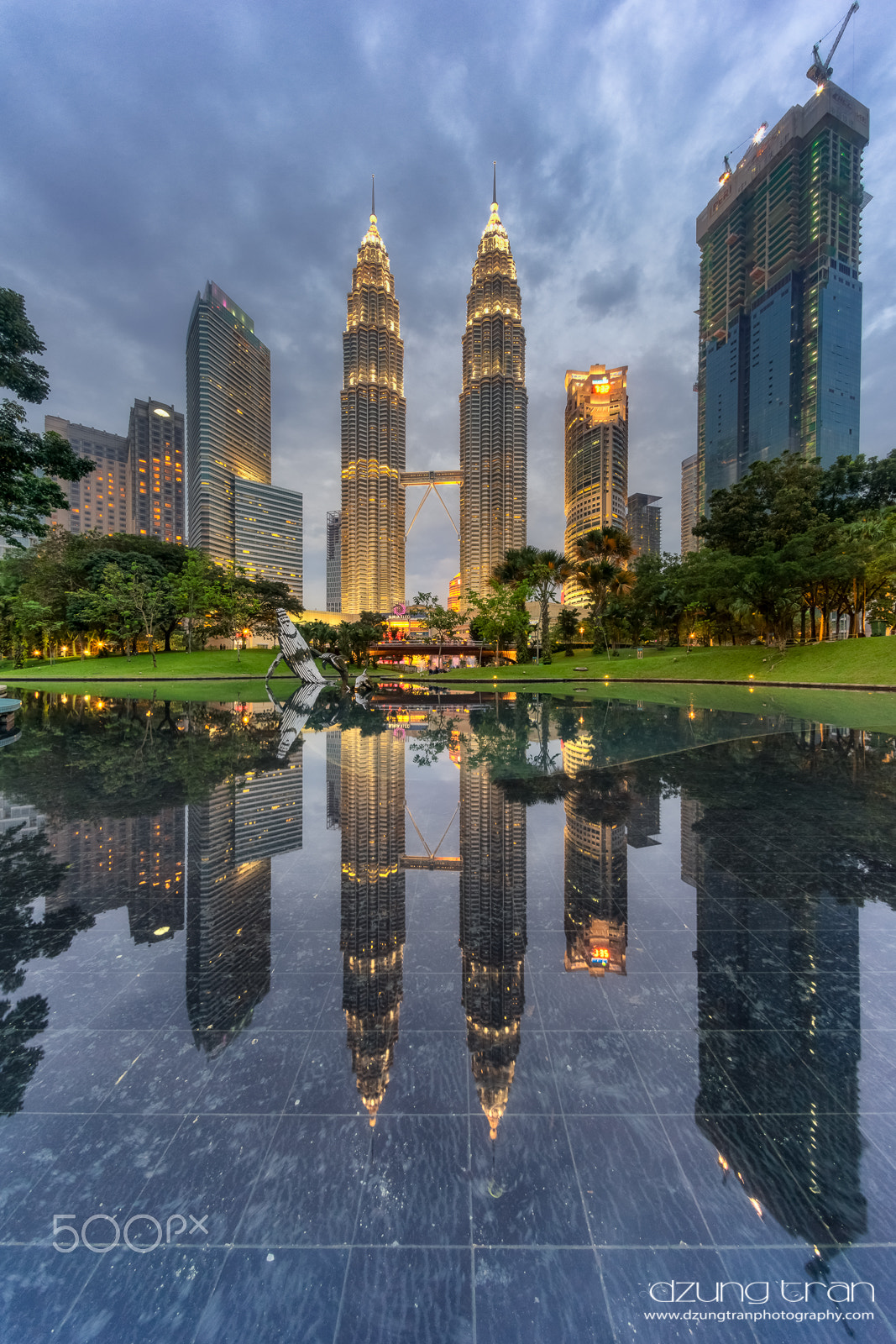 Sony a7R sample photo. Klcc in reflection photography