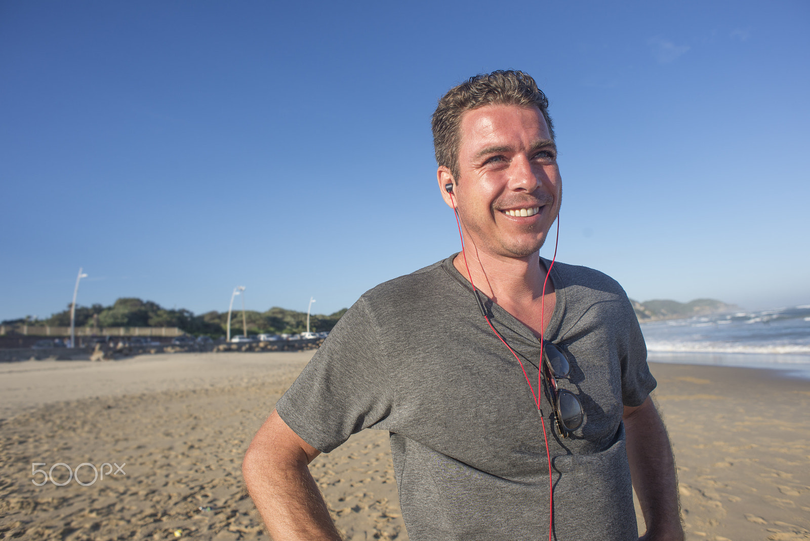 Nikon D600 sample photo. Man with earphones by beach photography