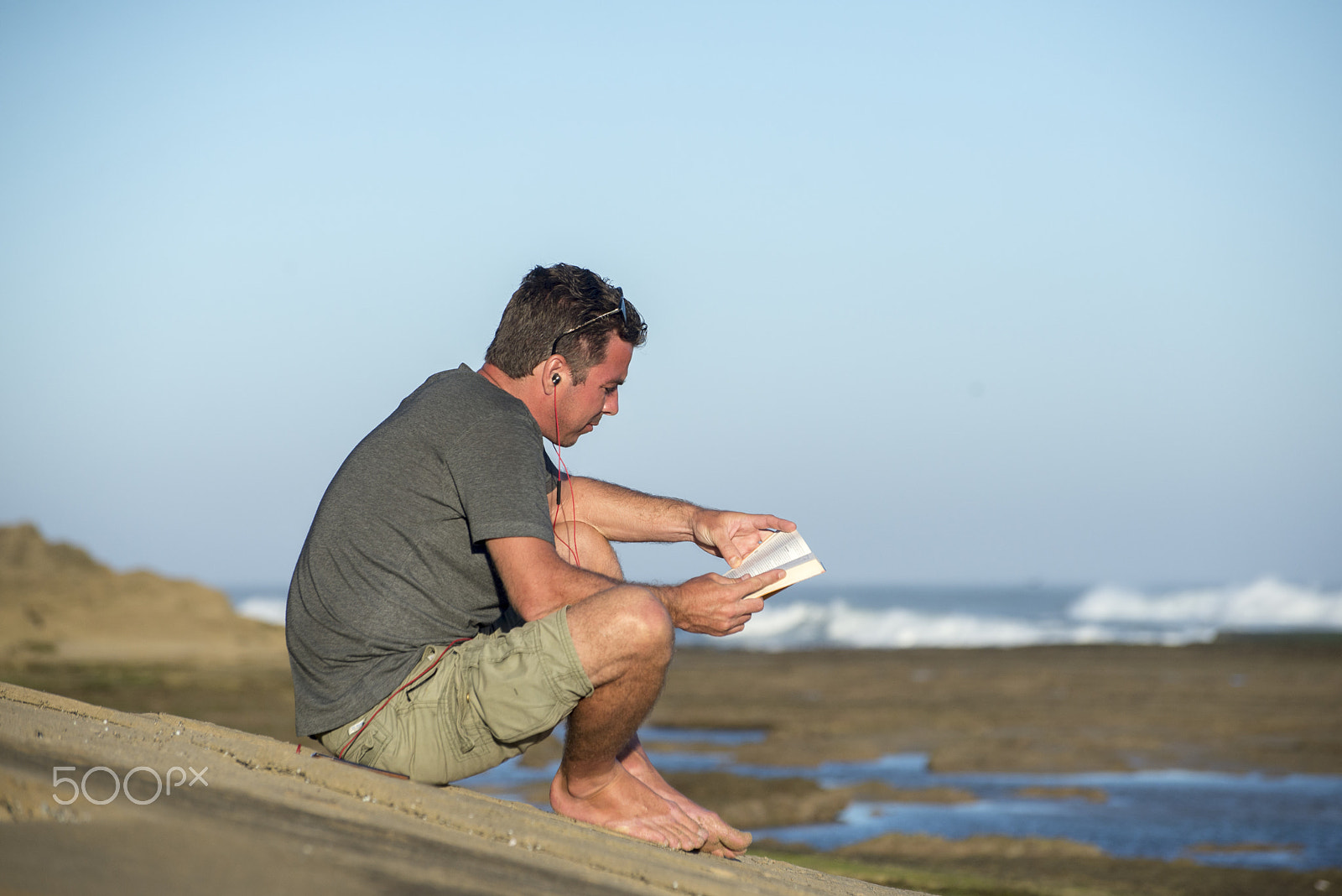 Nikon D600 sample photo. Man by oceand reading and listenting to music photography