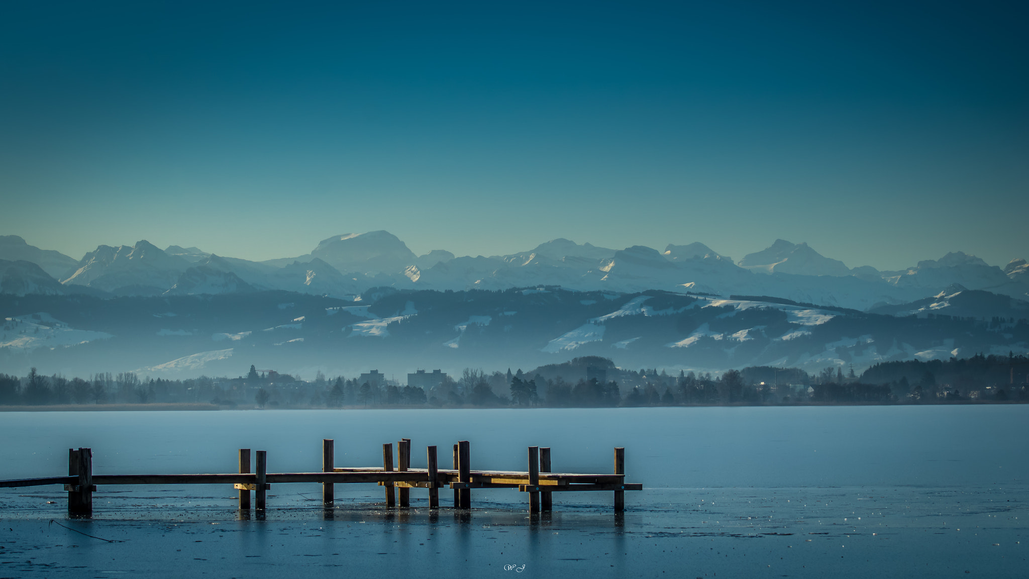 Sony ILCA-77M2 sample photo. Icy pier photography