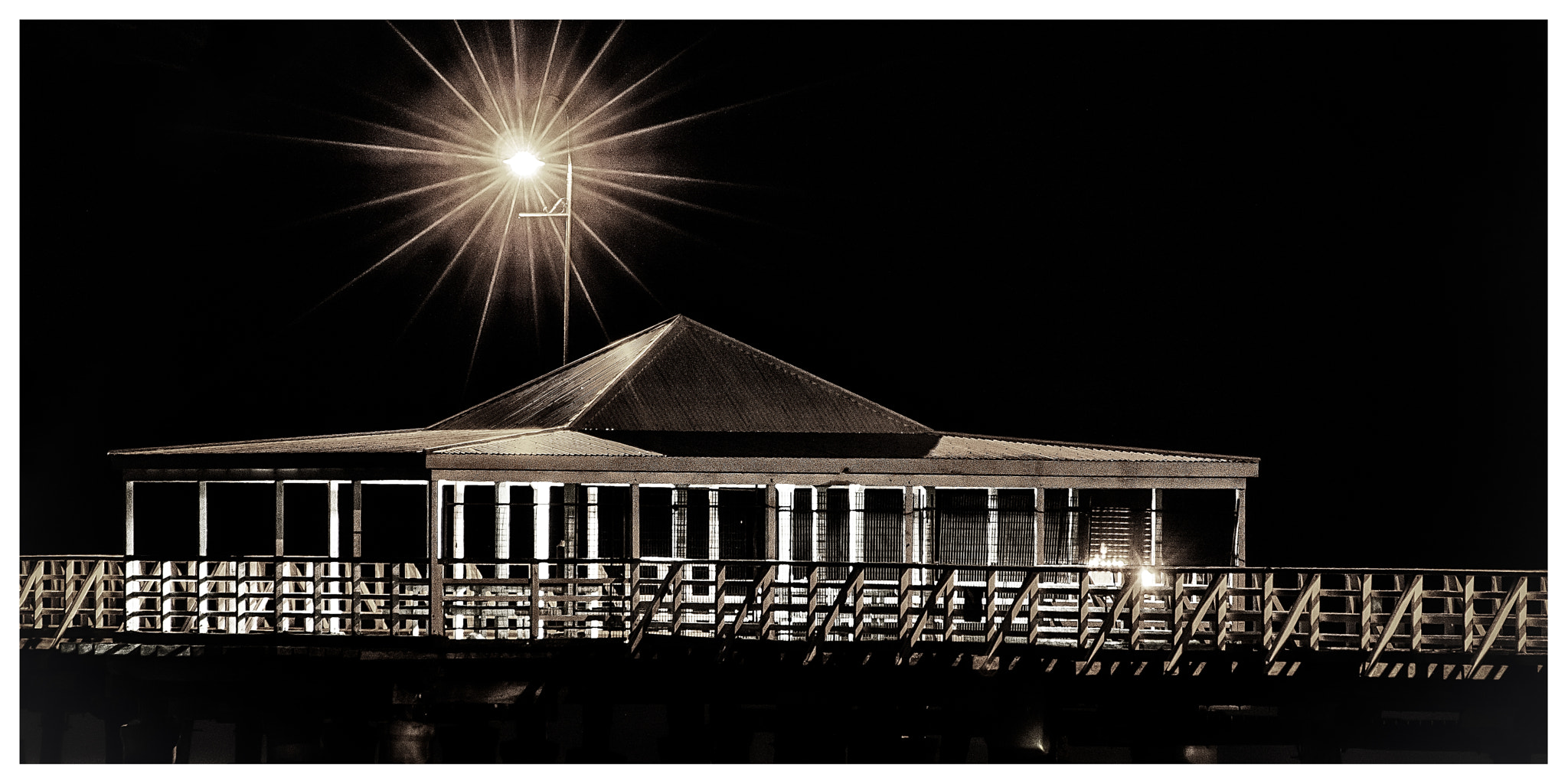 Sigma 50-500mm F4.5-6.3 DG OS HSM sample photo. Night time at the pier photography