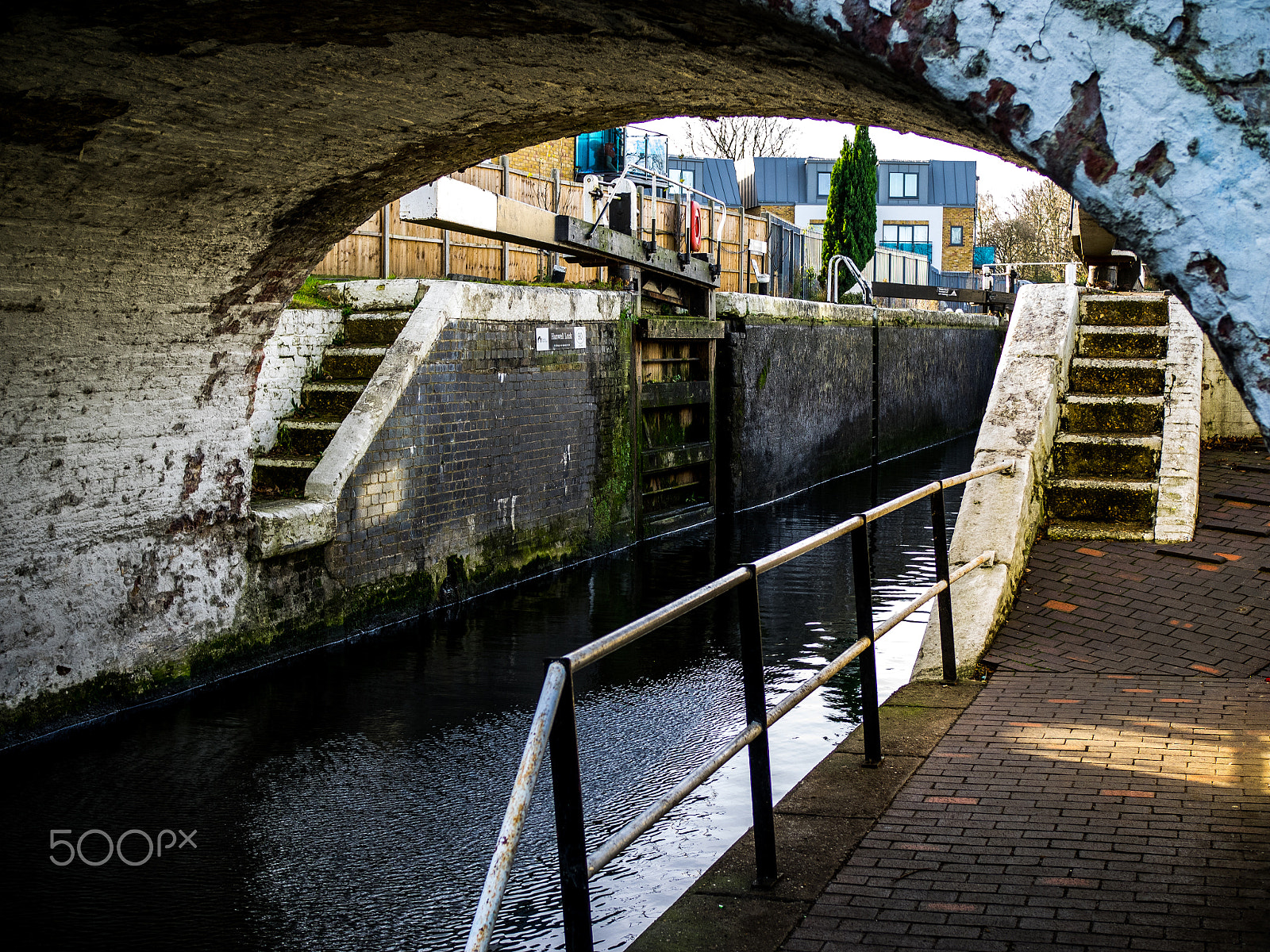 Olympus OM-D E-M1 sample photo. Canal lock and towpath, norwood, london photography