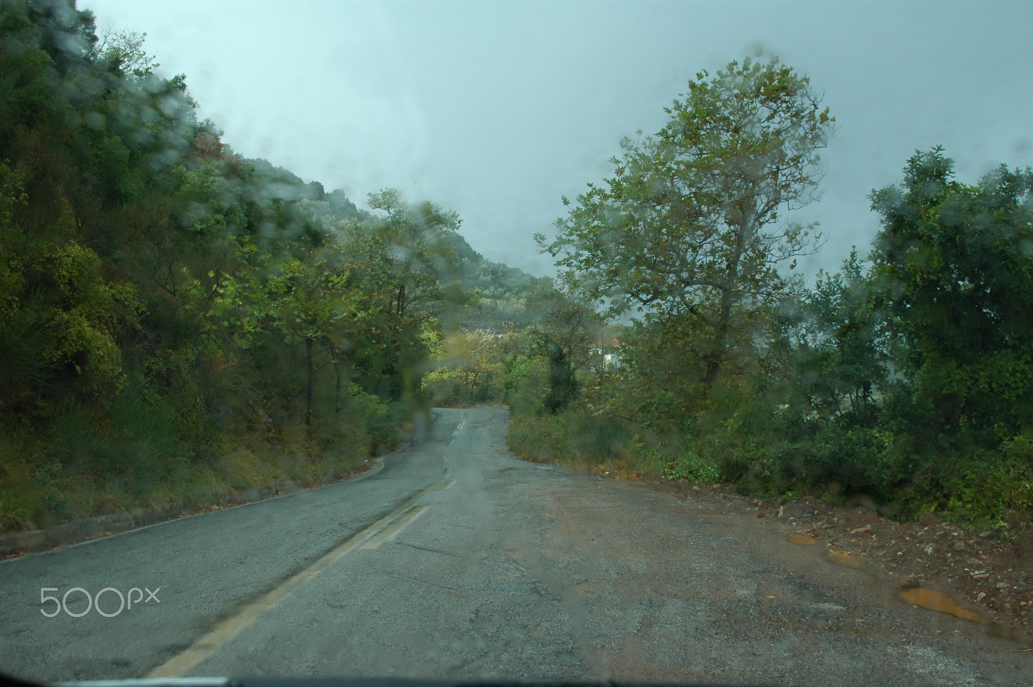 Nikon D70 sample photo. Raindrops on the windshield distort reality photography