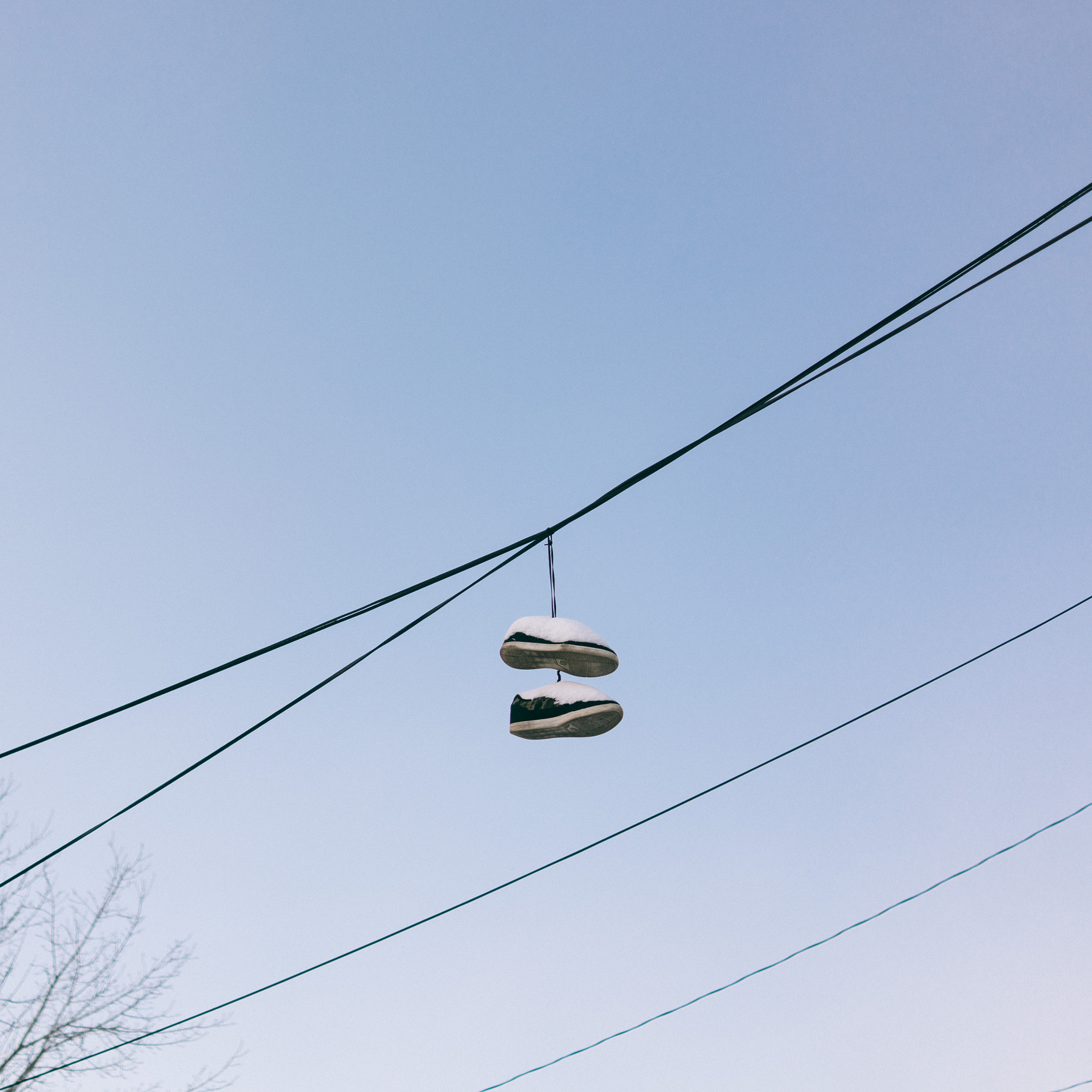 35mm F2.0 sample photo. Shoes on a line photography