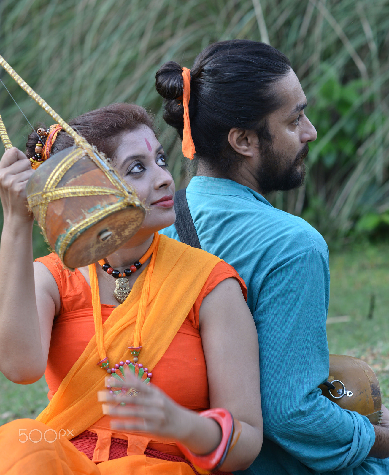 Nikon D800 + AF DC-Nikkor 135mm f/2D sample photo. Baul man and woman giving candid look holding ekta photography