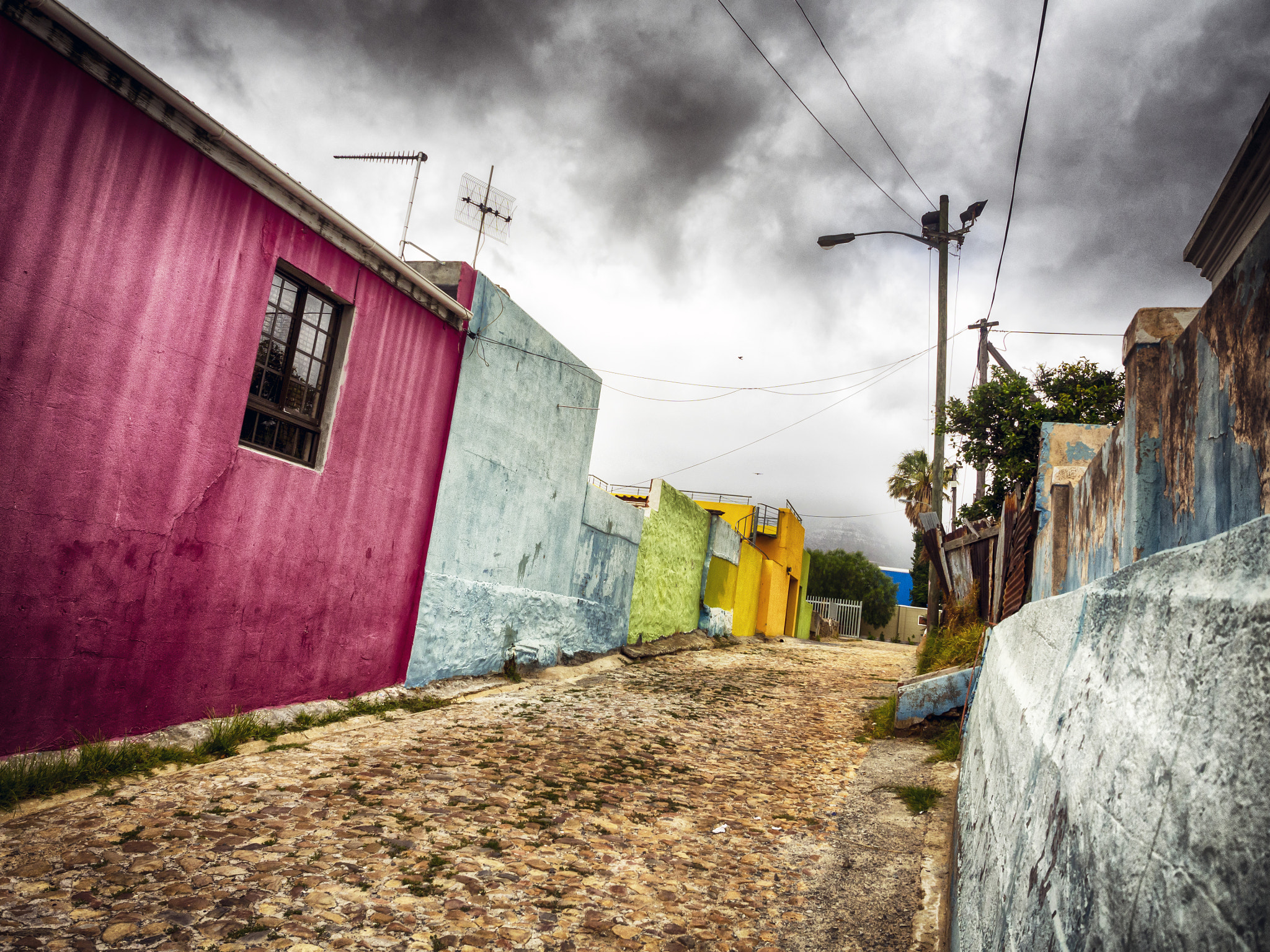 Olympus OM-D E-M10 + Olympus M.Zuiko Digital ED 12-40mm F2.8 Pro sample photo. Raw life contrasts of bo-kaap photography