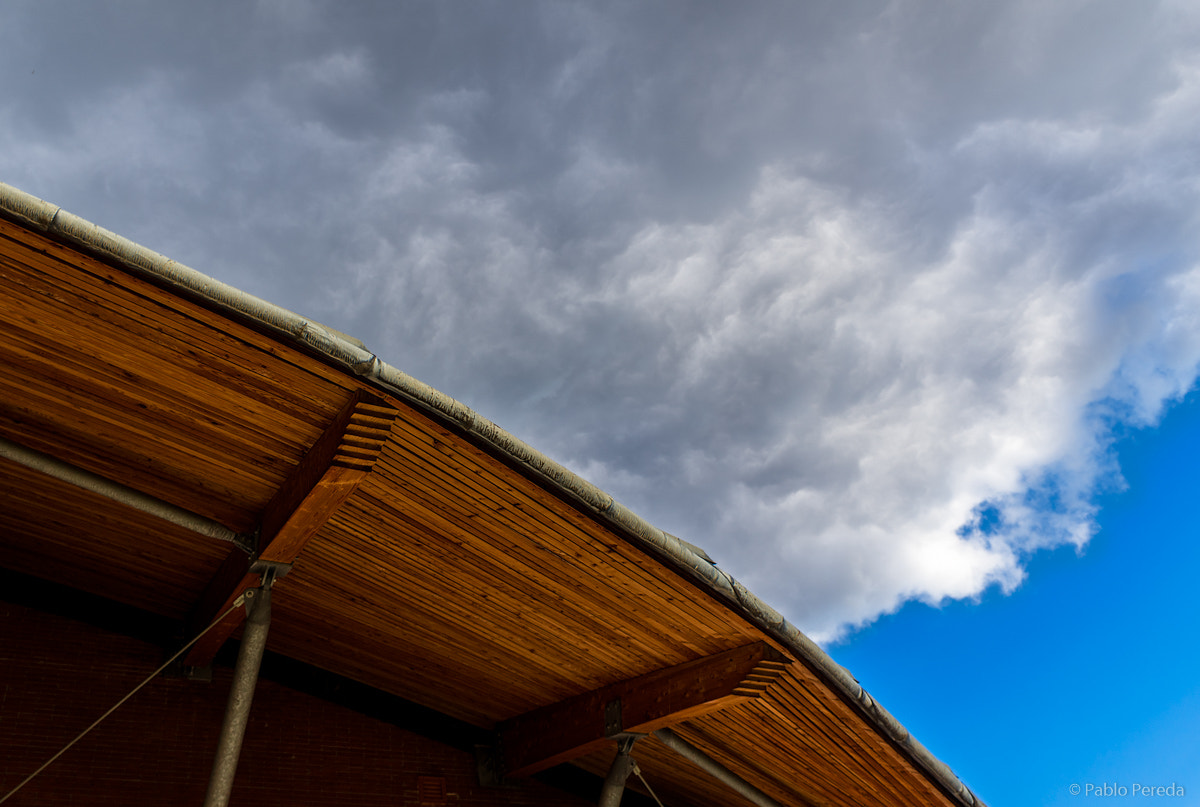 Sony a5100 sample photo. Clouds and wood photography