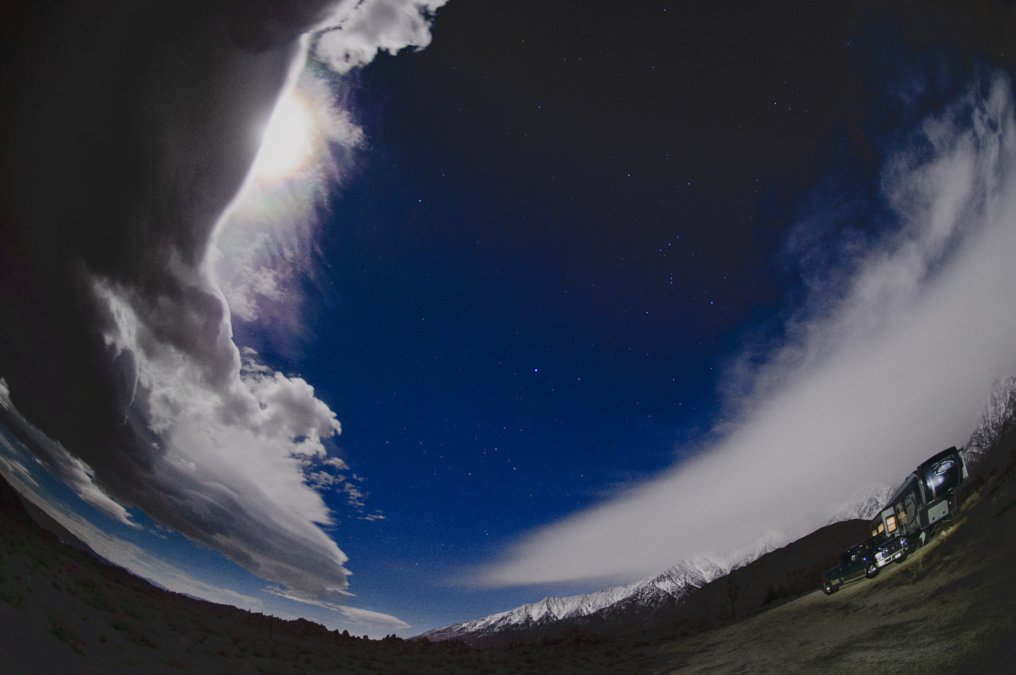 Nikon D4 sample photo. Full moon emerging from storm clouds over mtns. photography