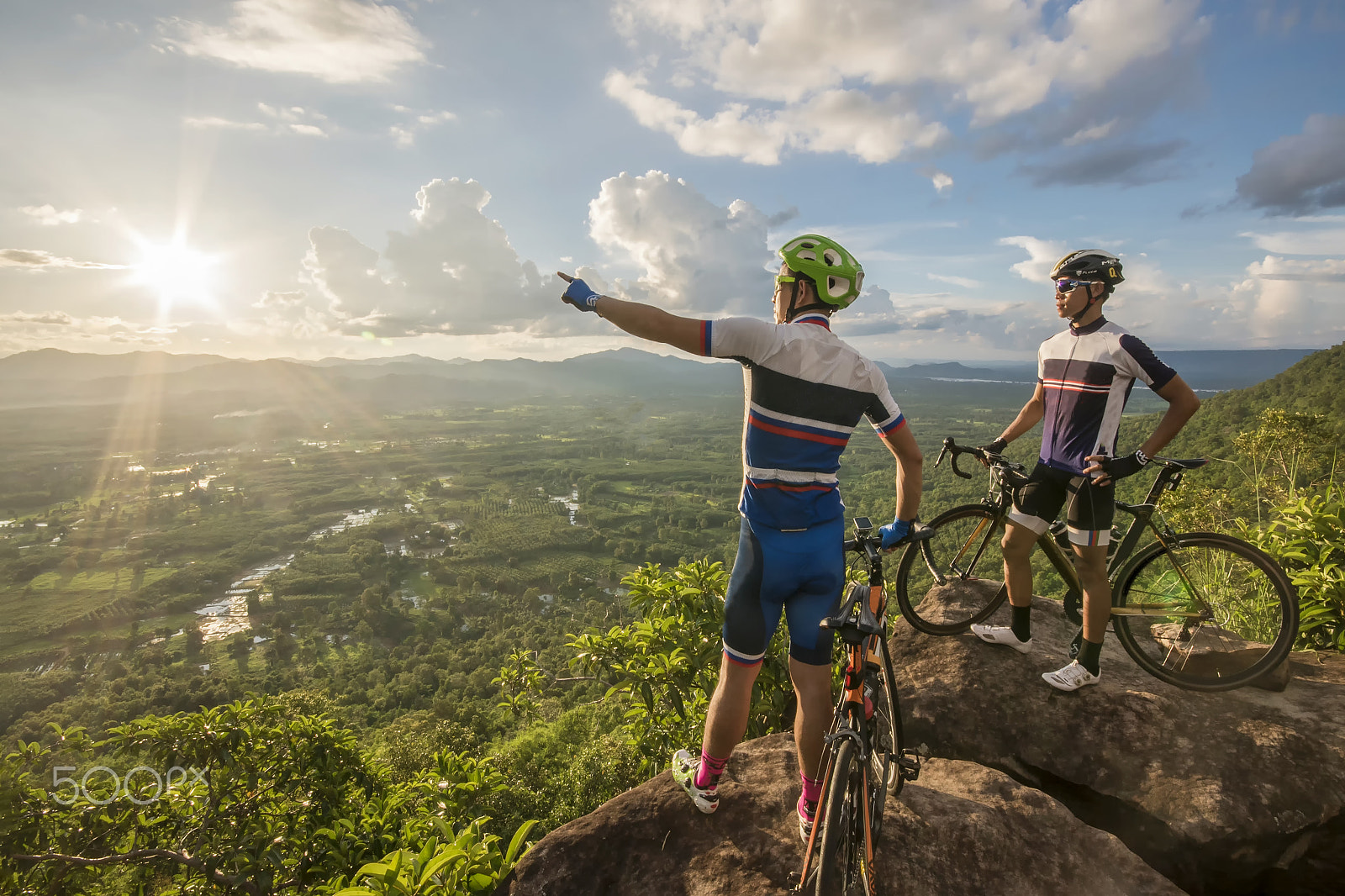 Sigma 10-20mm F4-5.6 EX DC HSM sample photo. Two man in helmet and glasses stay on the bicycle under sky with photography