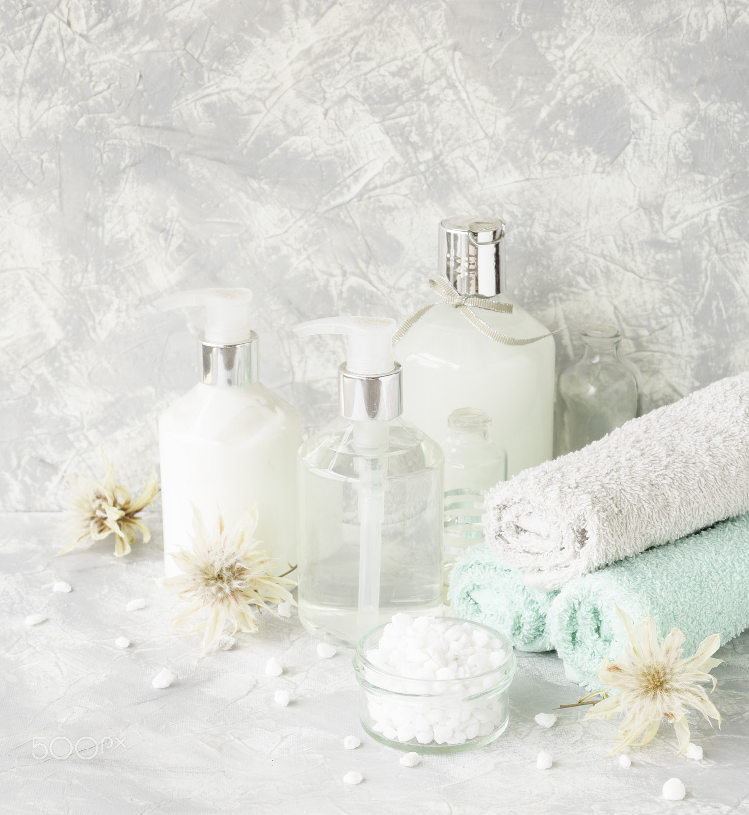 Nikon AF-S DX Micro Nikkor 40mm F2.8 sample photo. Spa set on a white marble table with a stack of towels, selective focus photography