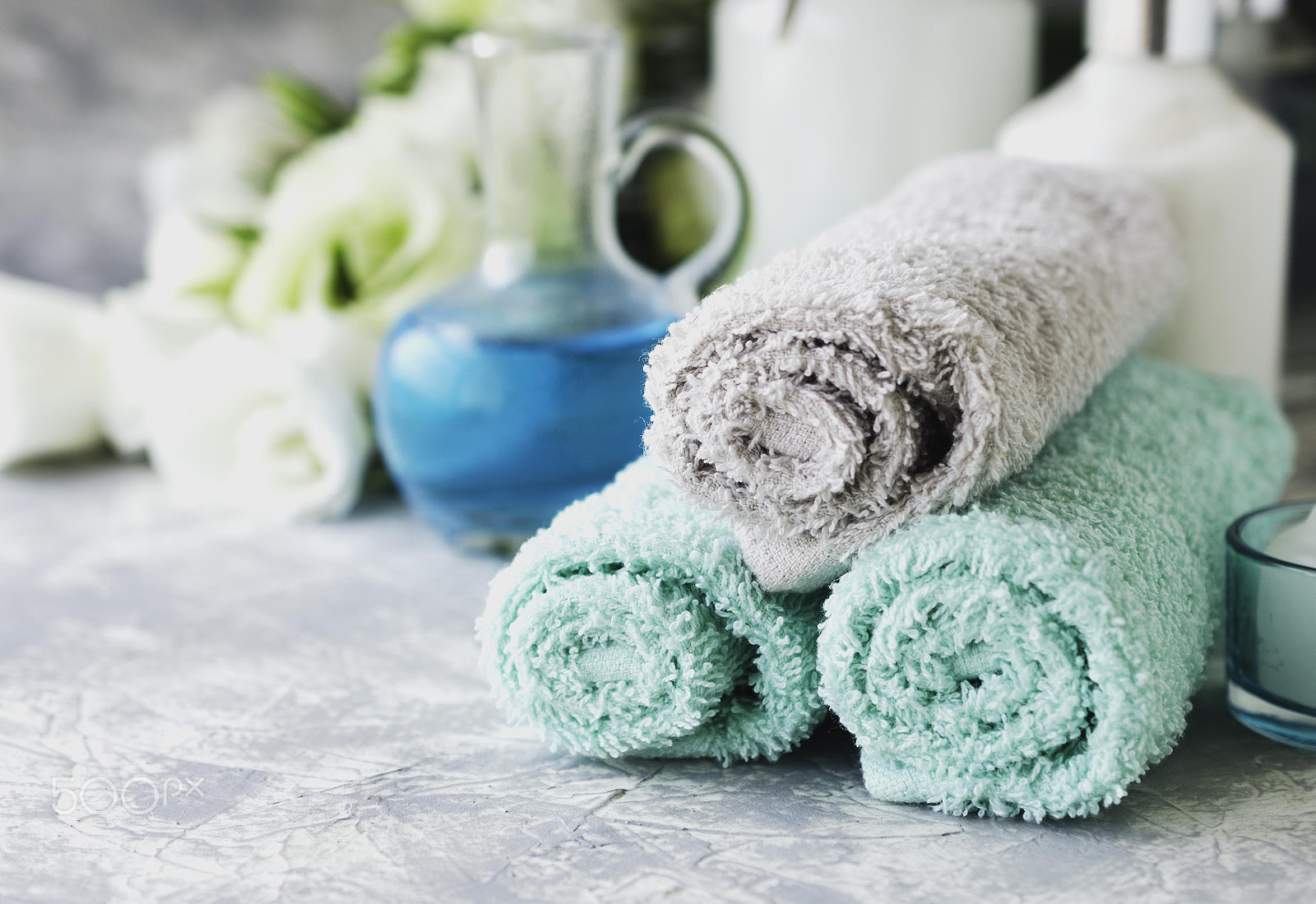 Nikon AF-S DX Micro Nikkor 40mm F2.8 sample photo. Spa set on a white marble table with a stack of towels, selective focus photography