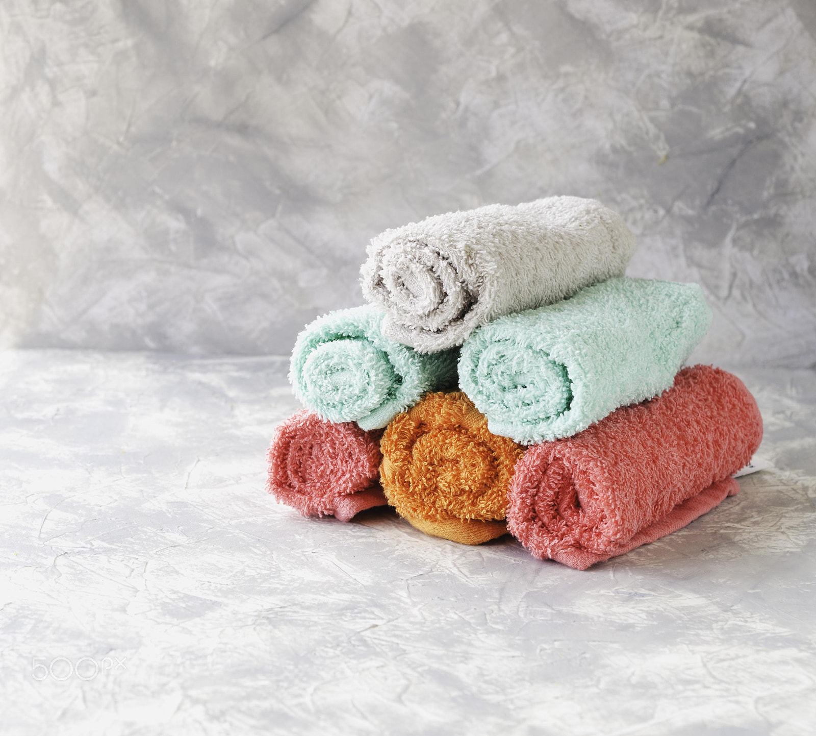Nikon AF-S DX Micro Nikkor 40mm F2.8 sample photo. Stack of towels on a marble table, a space under the text, selective focus photography