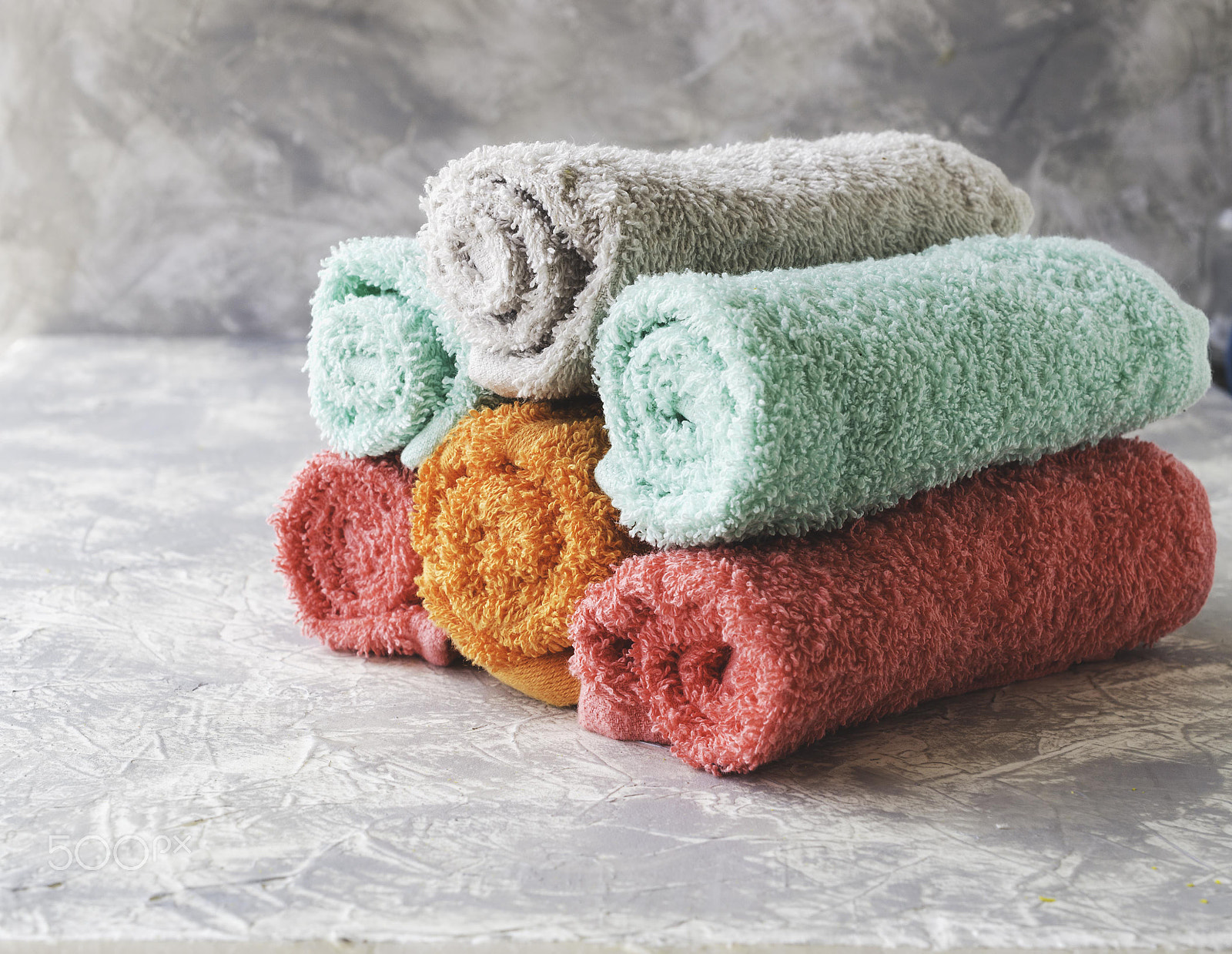 Nikon D7000 sample photo. Stack of towels on a marble table, a space under the text, selective focus photography