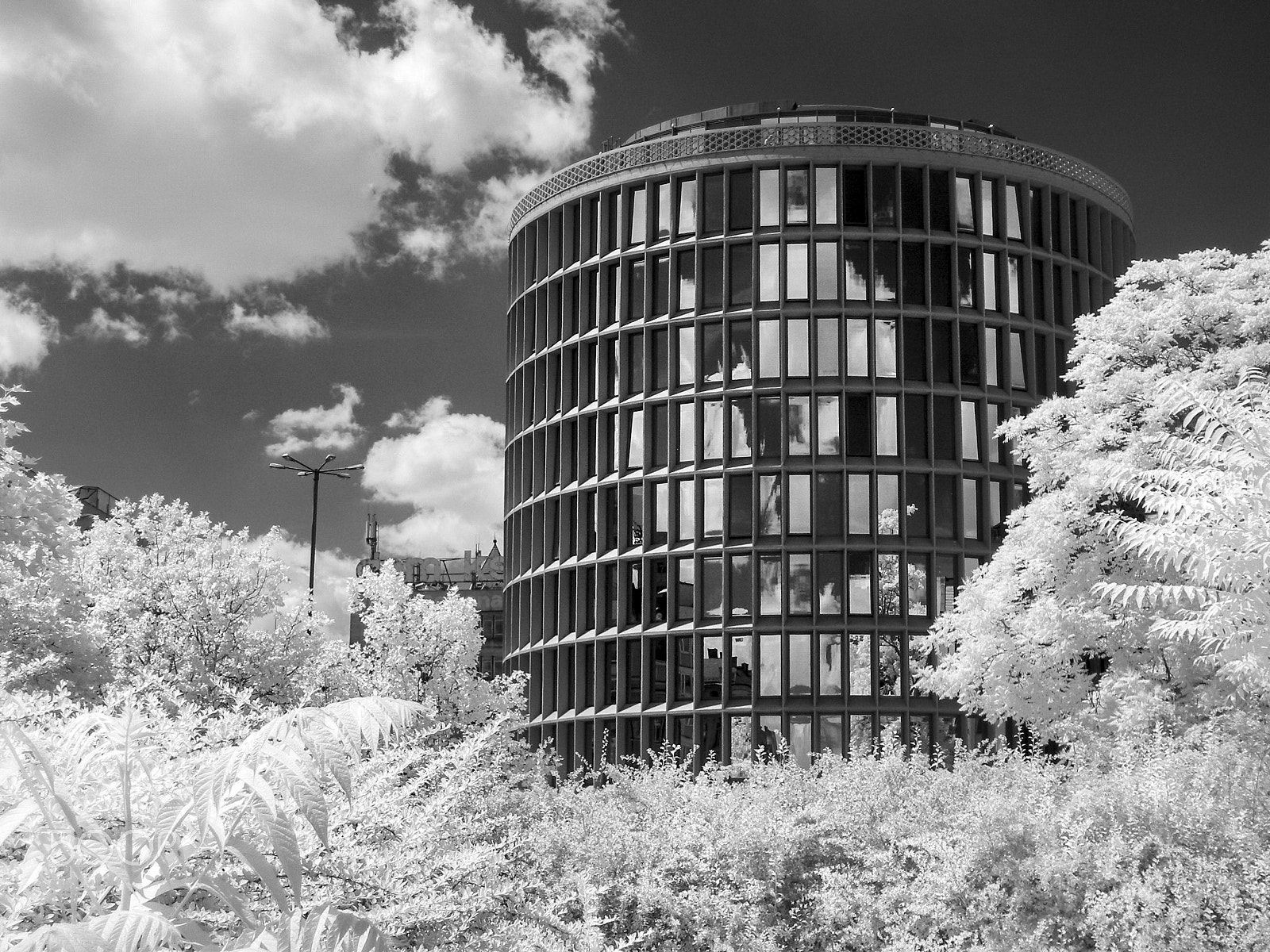 Olympus SP320 sample photo. Modernist roud office building in poznań photography