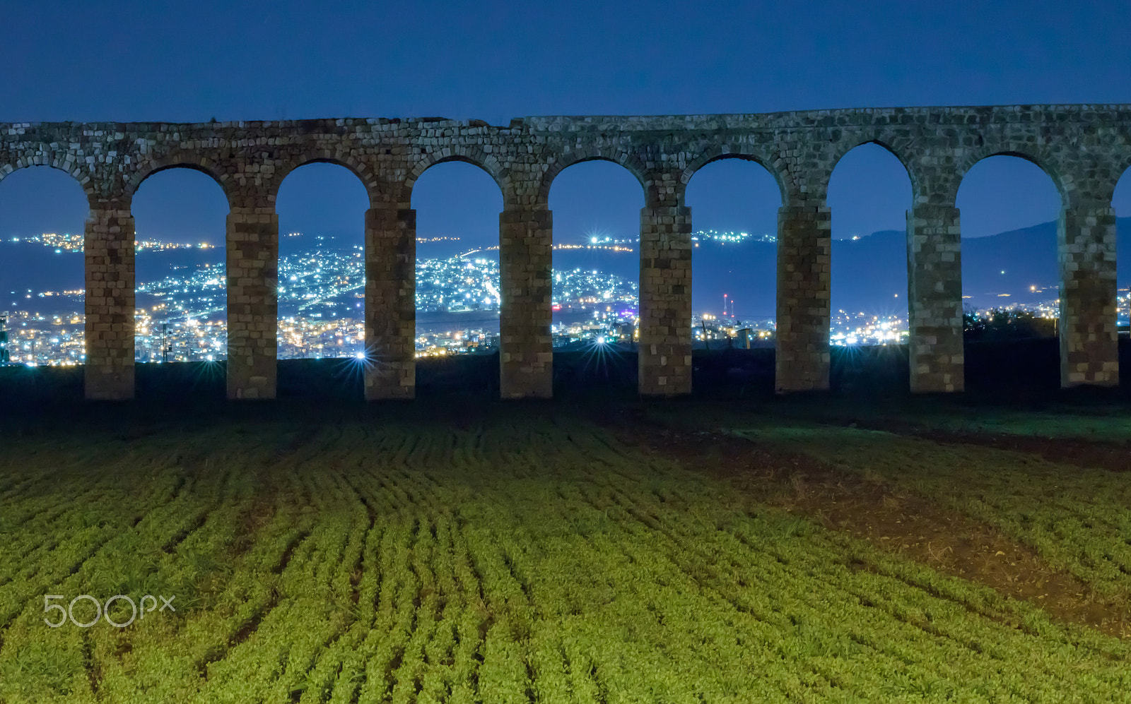 Canon EOS 80D + Sigma 50-200mm F4-5.6 DC OS HSM sample photo. Remains of an ancient roman aqueduct at night photography