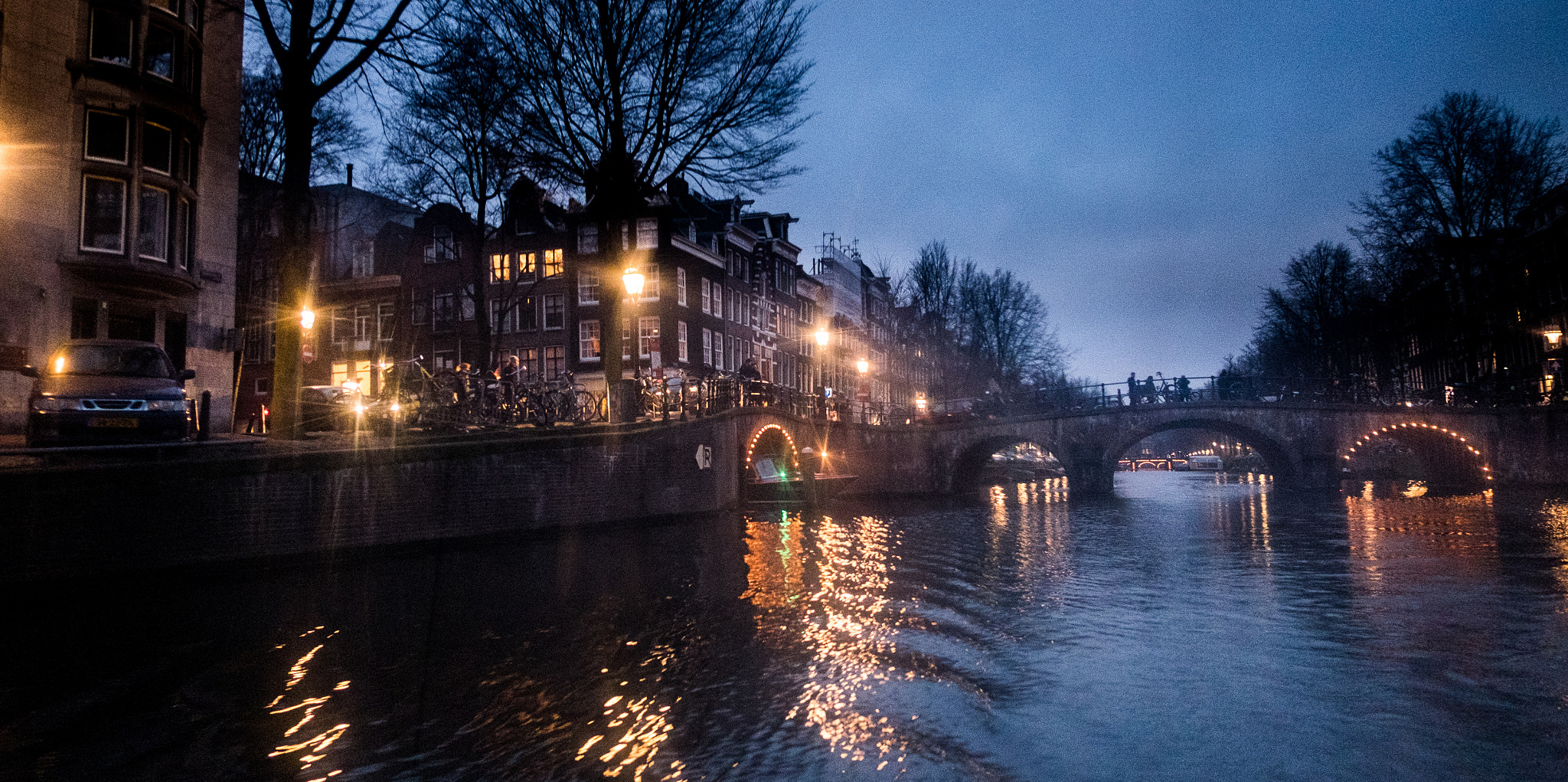 Fujifilm X-E2 + Fujifilm XF 18mm F2 R sample photo. Nighttime view of bridge in amsterdam photography