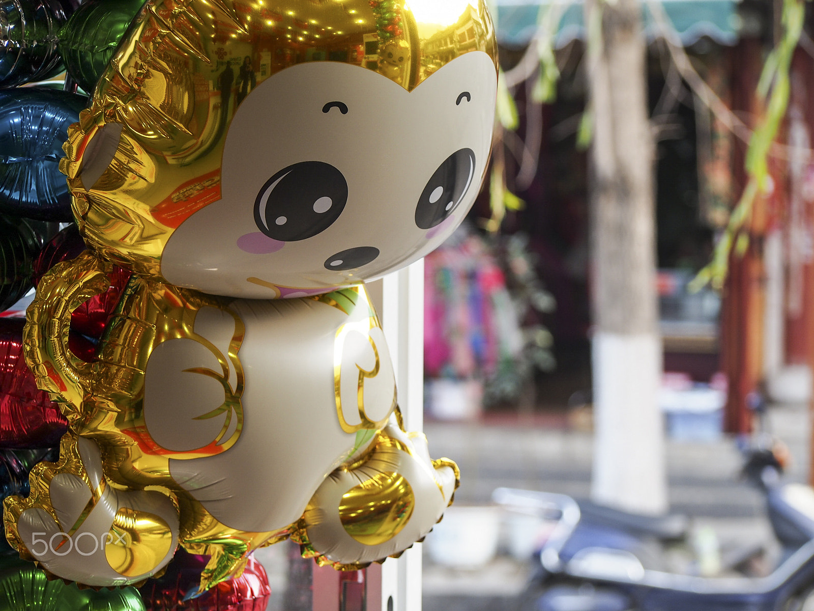Olympus OM-D E-M5 sample photo. Golden monkey balloon on sale for chinese new year photography