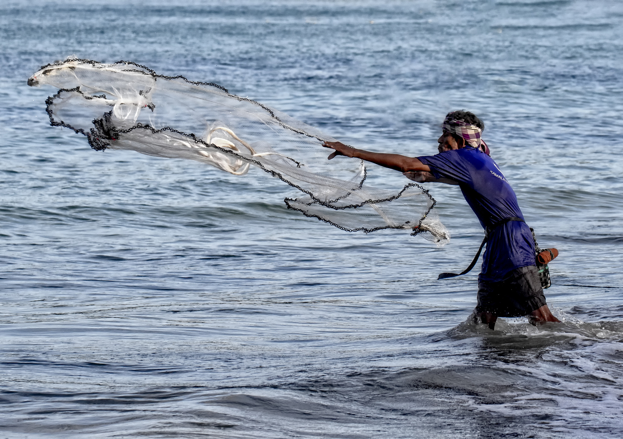 Canon EF 70-300mm F4-5.6L IS USM sample photo. Local fisherman throwing his net photography