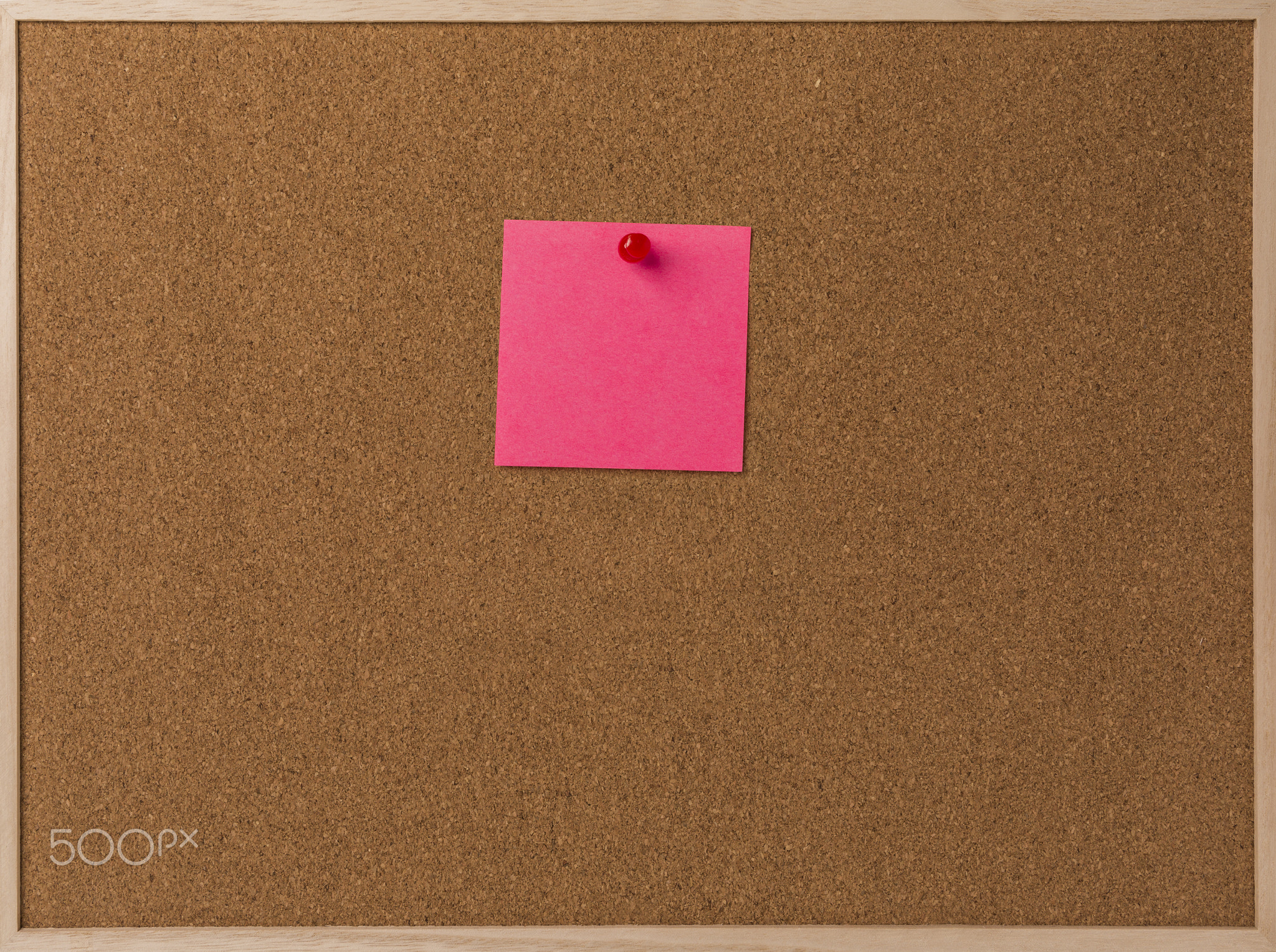 Pink Blank sticky notes red pinned into brown corkboard.