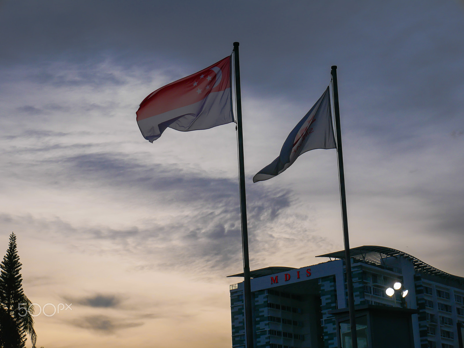 Panasonic Lumix DMC-G7 sample photo. Singapore flag with ssc flag near mdis photography