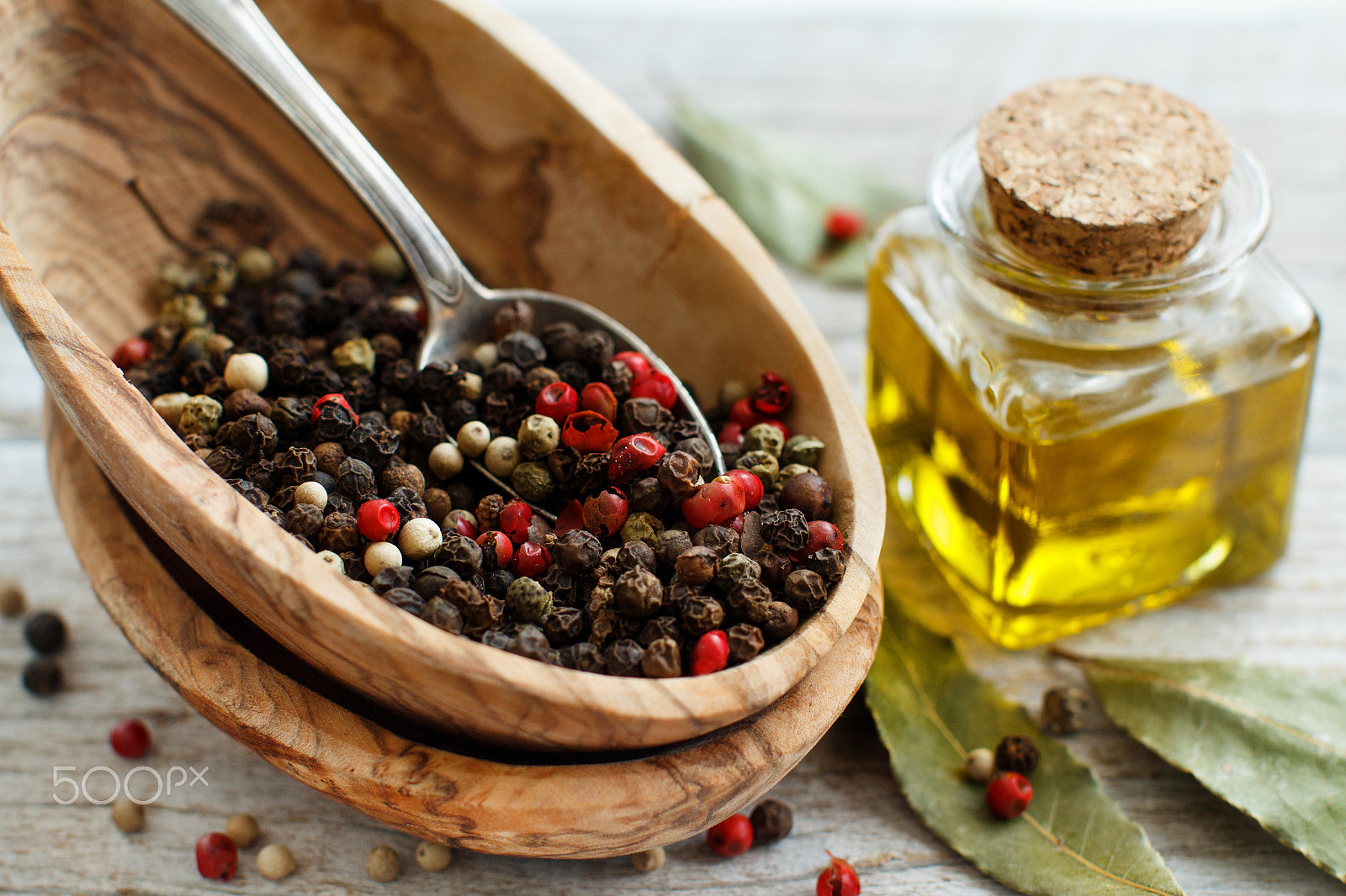 Canon EOS 650D (EOS Rebel T4i / EOS Kiss X6i) + Canon EF 50mm F1.2L USM sample photo. Peppercorn mix in a bowl, bay leaves  and olive oil photography