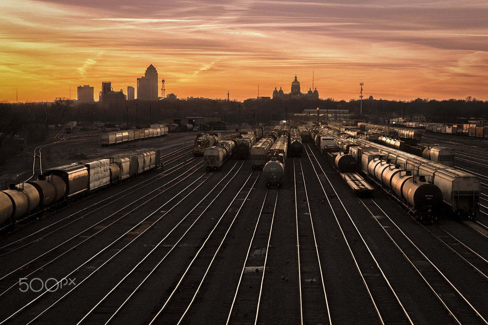 Canon EF-S 17-85mm F4-5.6 IS USM sample photo. "rail yard sunset" photography