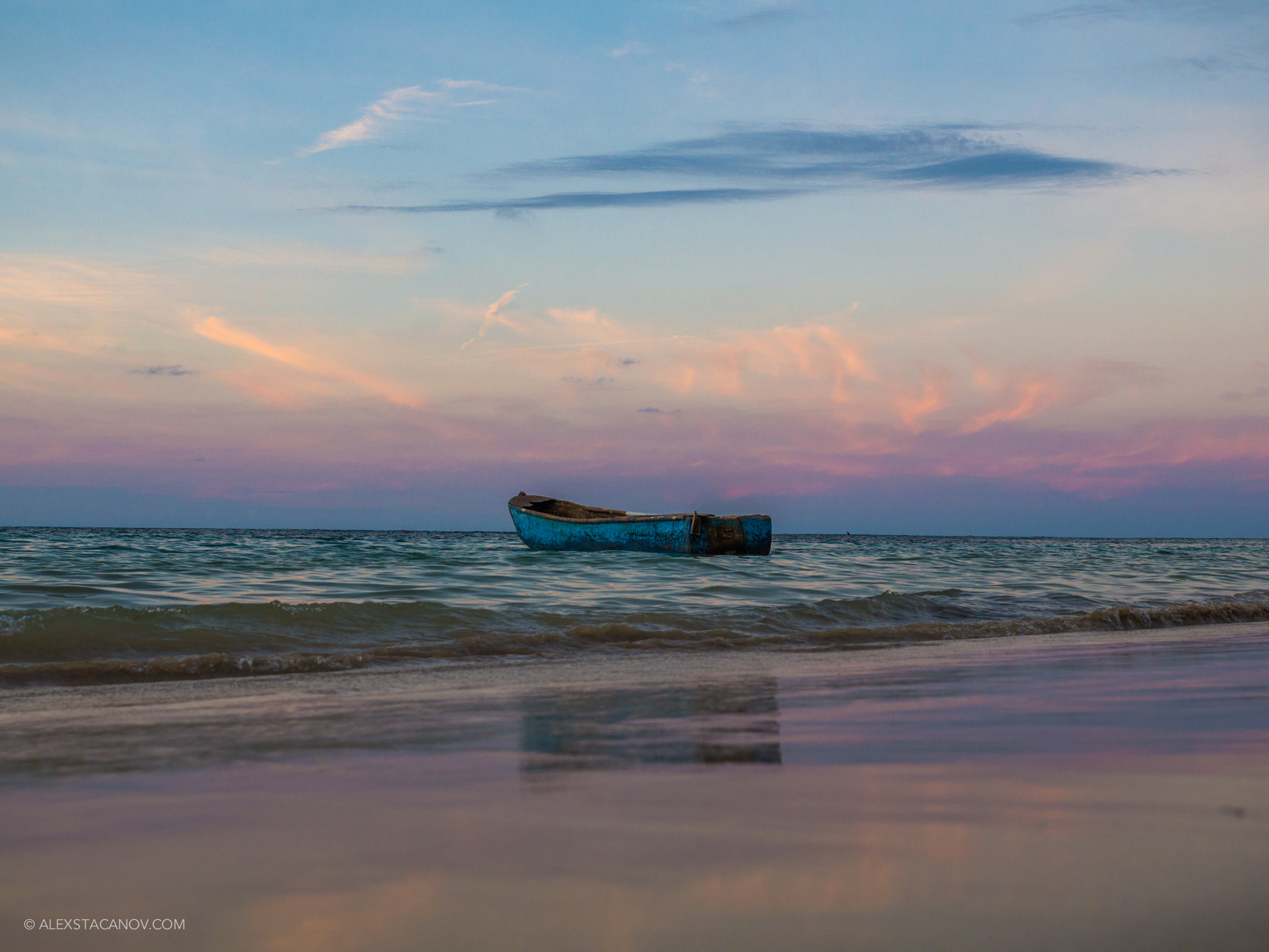 Panasonic Lumix G X Vario 12-35mm F2.8 ASPH Power OIS sample photo. Boat reflection during beautiful sunset photography