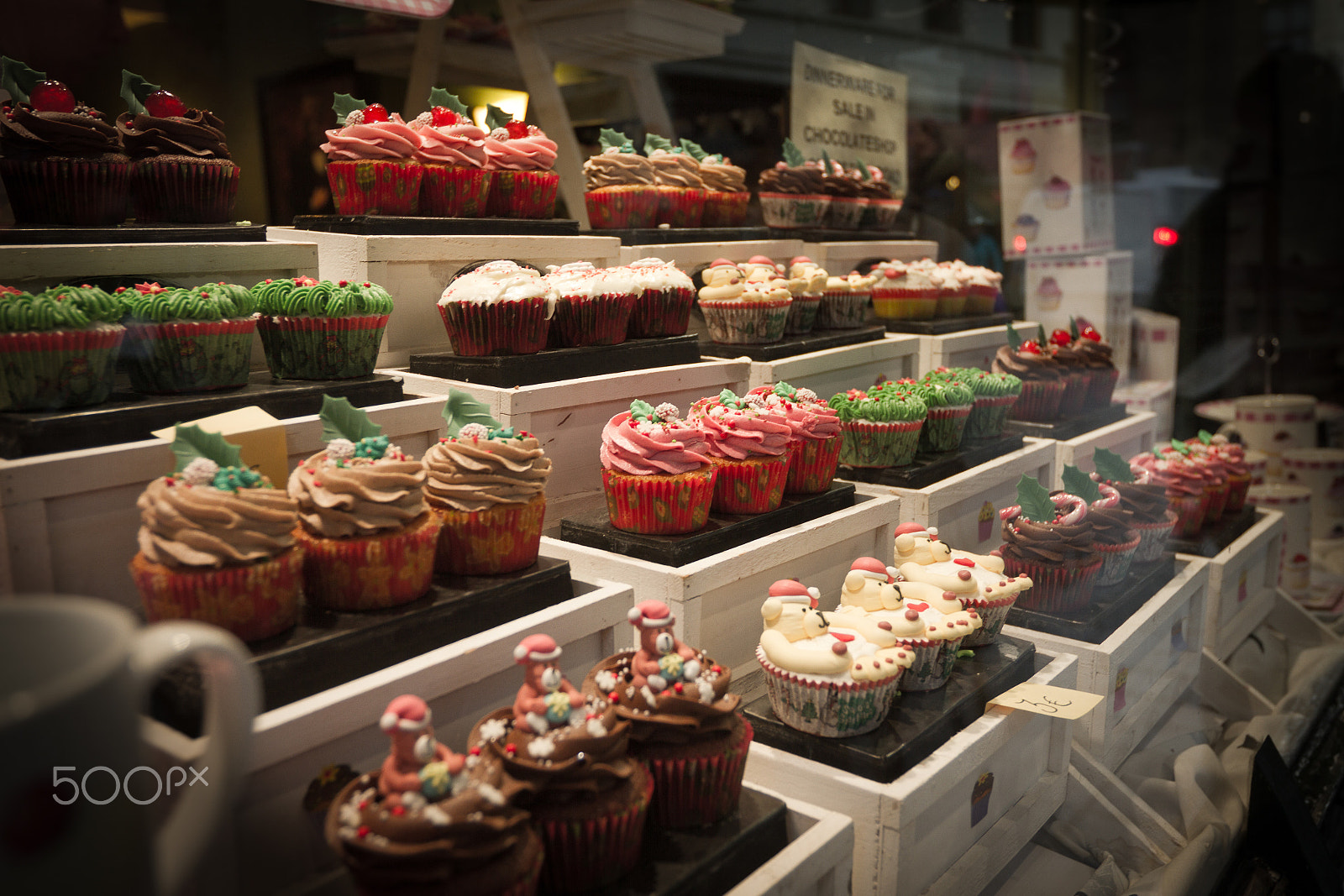 Canon EOS 7D sample photo. Display of colorful iced muffins in a bakery photography