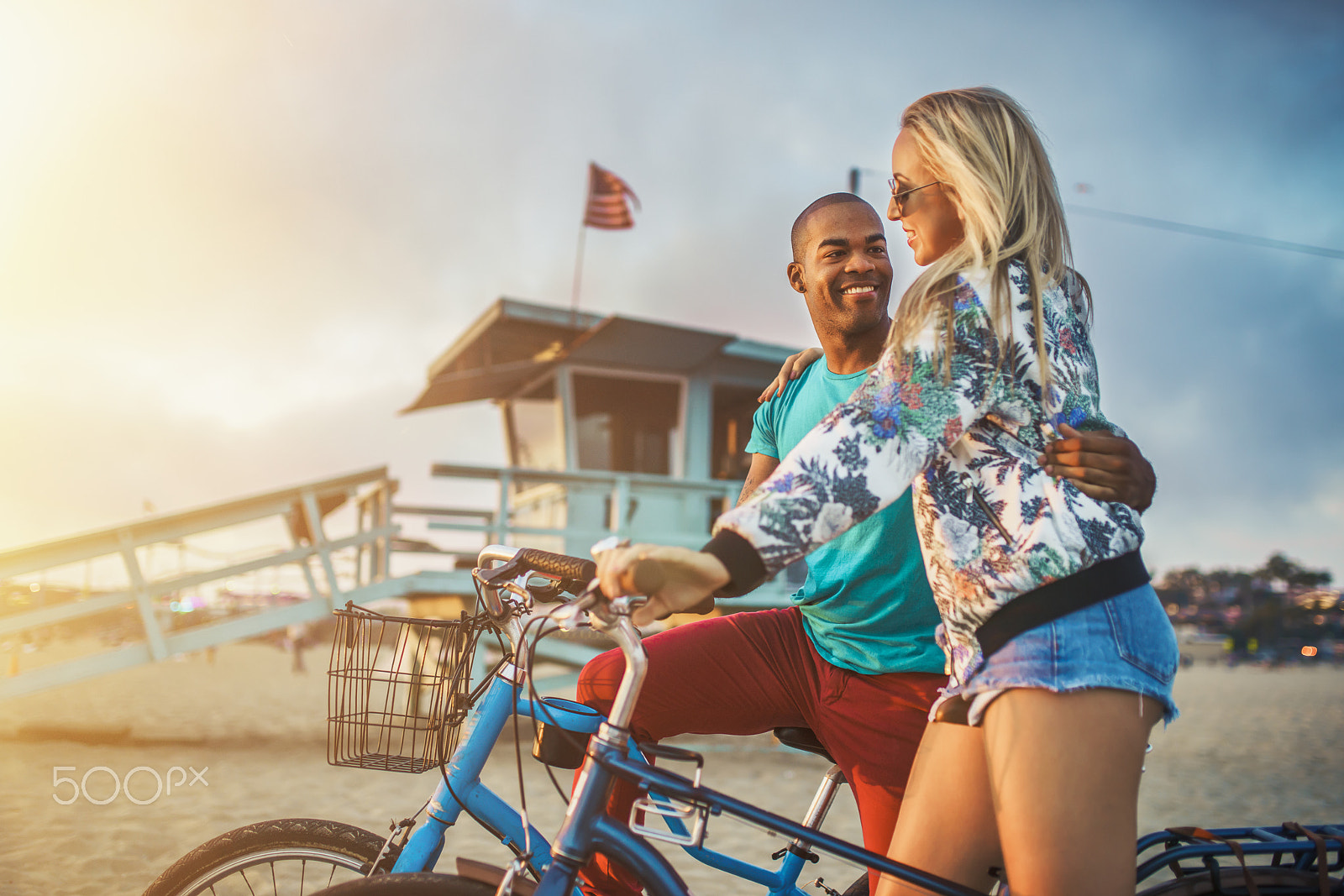 Sony a7R II sample photo. Romantic couple watch sunset on santa monica beach after bike ride photography