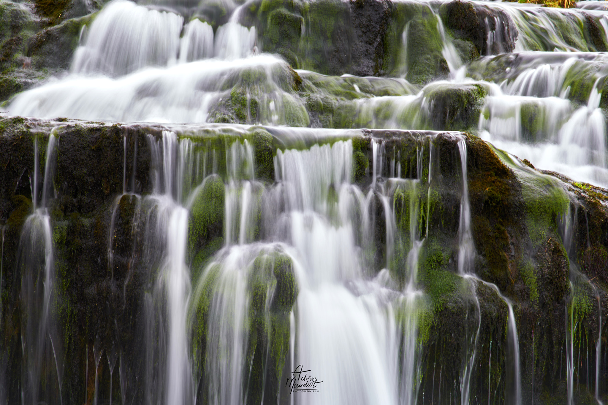 70-300mm F3.8-5.4 OSS sample photo. Green waterfall photography