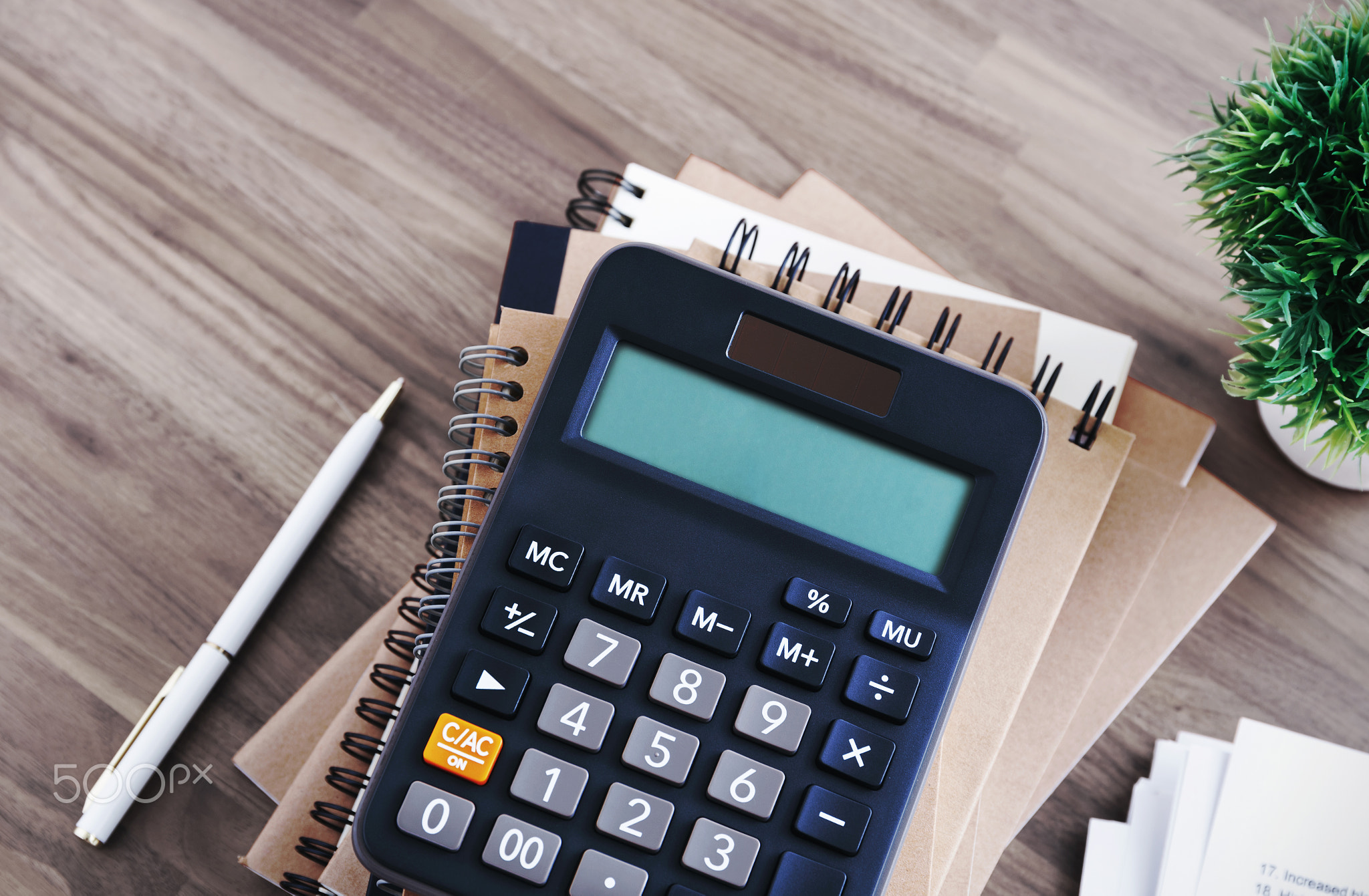 Calculator on office desk background