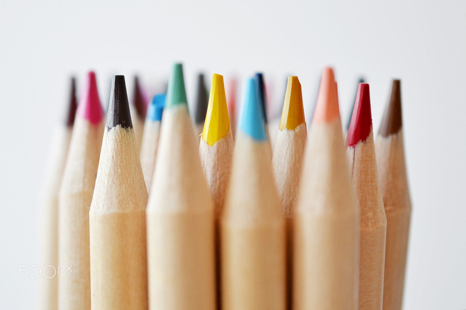 Nikon AF-S DX Micro Nikkor 40mm F2.8 sample photo. Colored pencil tops on white background photography