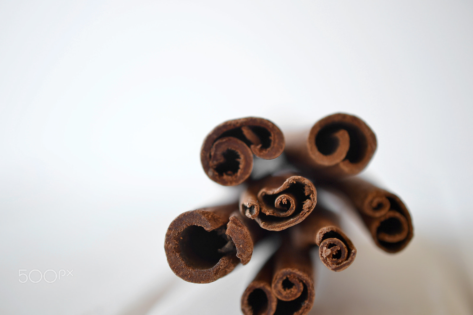 Nikon AF-S DX Micro Nikkor 40mm F2.8 sample photo. Cinnamon sticks on white background photography