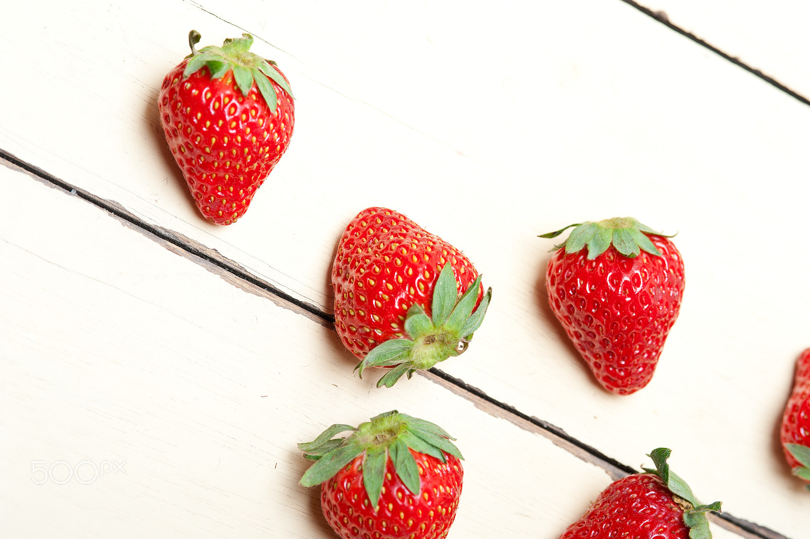 Nikon D700 + AF Micro-Nikkor 105mm f/2.8 sample photo. Fresh organic strawberry over white wood photography