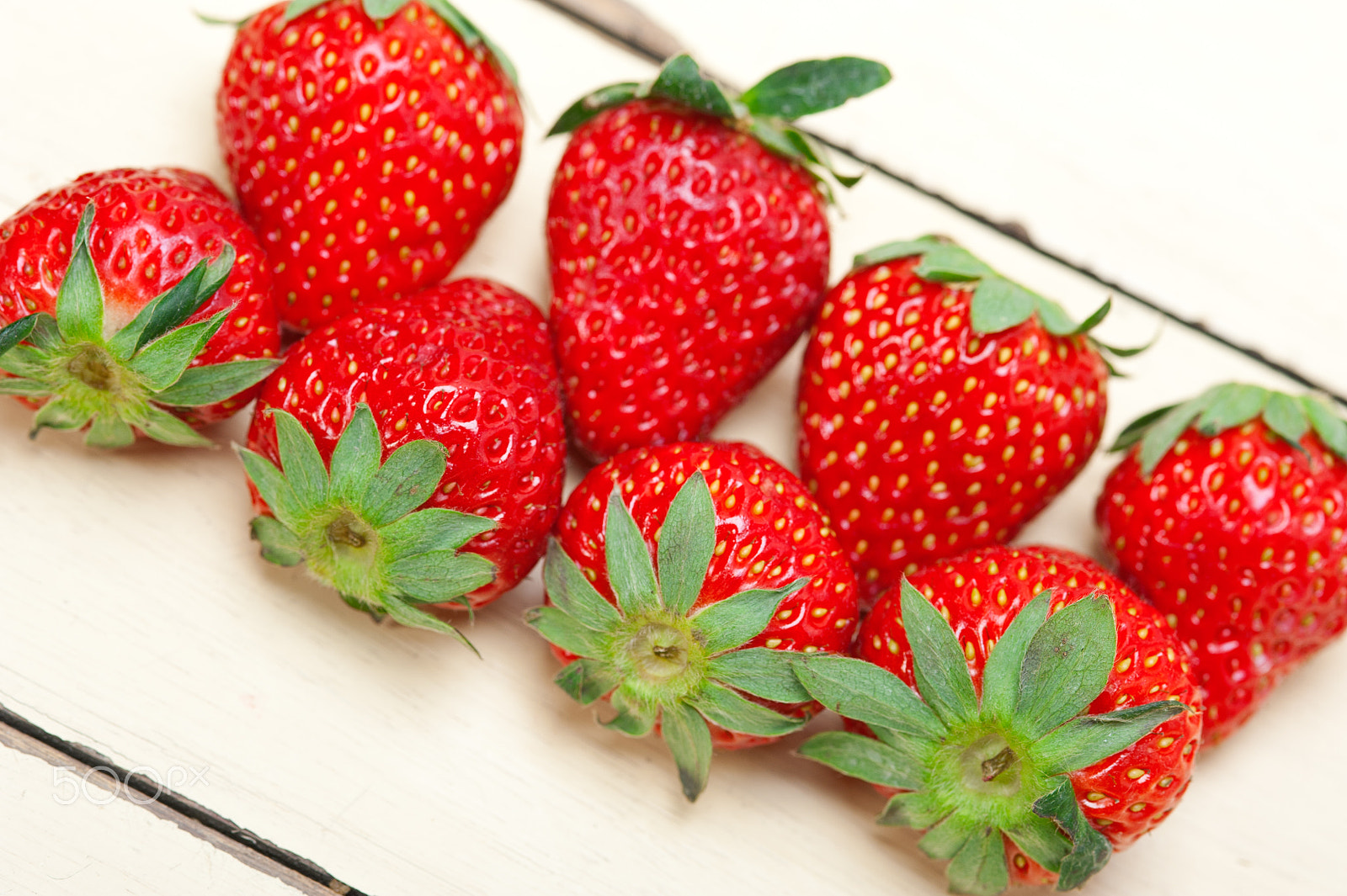 Nikon D700 + AF Micro-Nikkor 105mm f/2.8 sample photo. Fresh organic strawberry over white wood photography