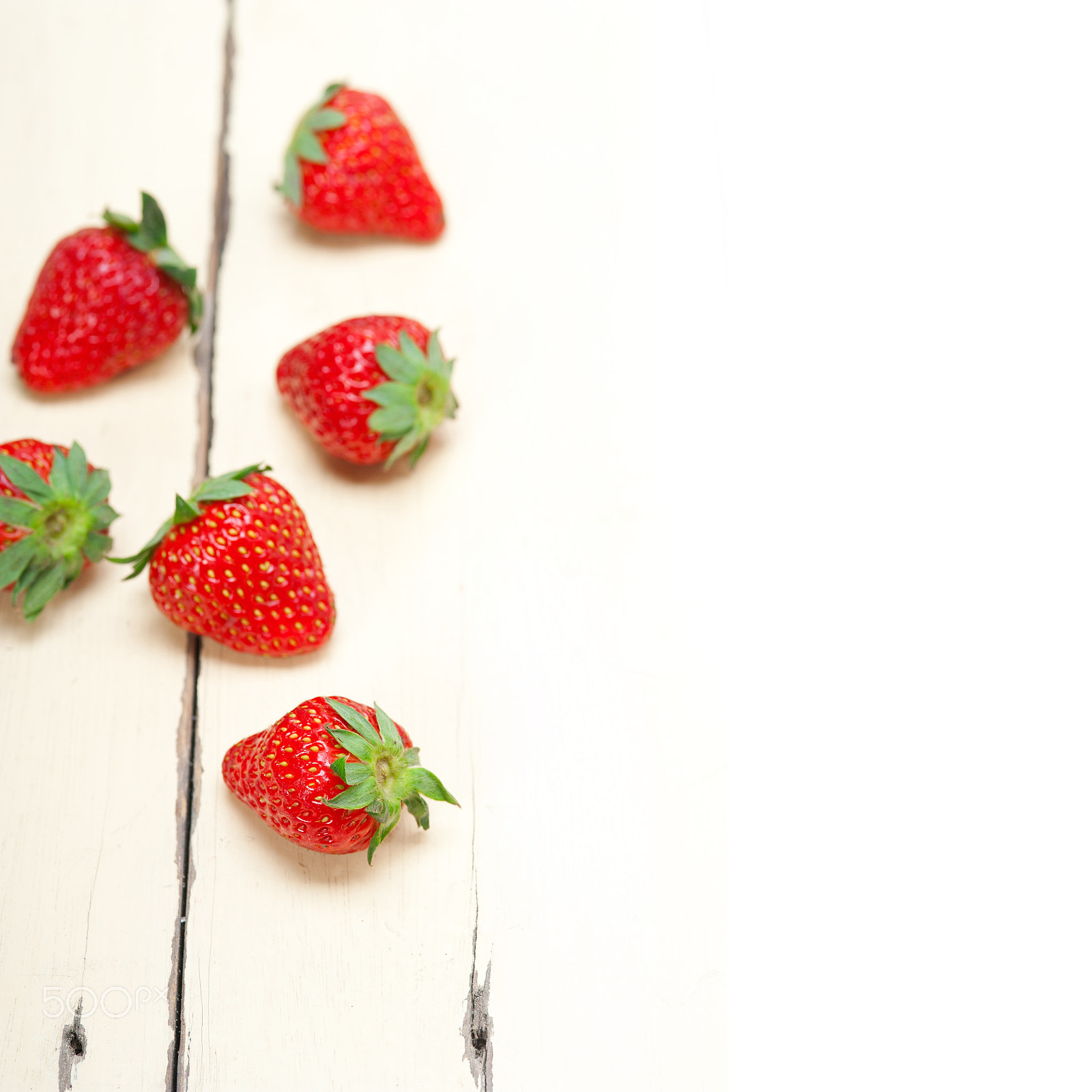 AF Micro-Nikkor 105mm f/2.8 sample photo. Fresh organic strawberry over white wood photography