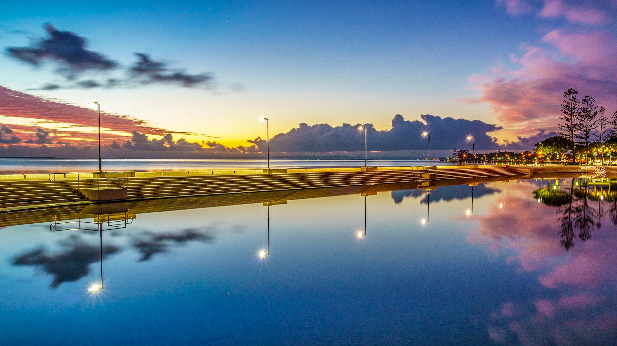 Sony a6000 + Sony E 18-200mm F3.5-6.3 OSS sample photo. Reflections in wynnum baths at sunrise photography