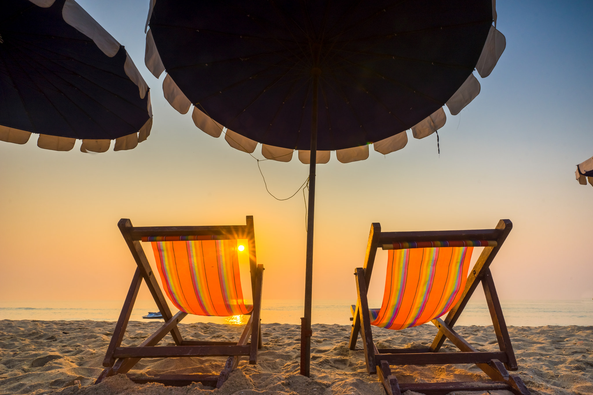 Sony a7 + Sony Vario-Sonnar T* 16-35mm F2.8 ZA SSM sample photo. Chaises longues on the beach at sunrise photography