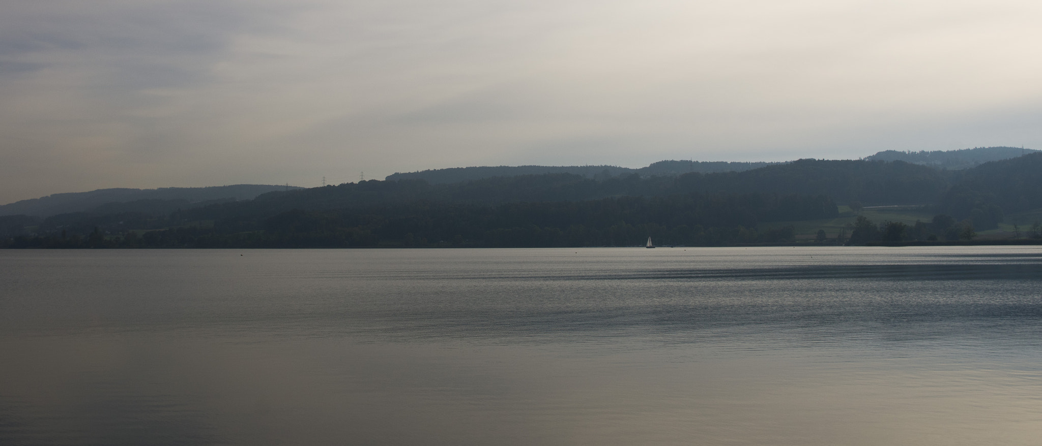 Pentax K-5 + smc PENTAX-DA L 18-55mm F3.5-5.6 sample photo. Lonely boat on a lake photography